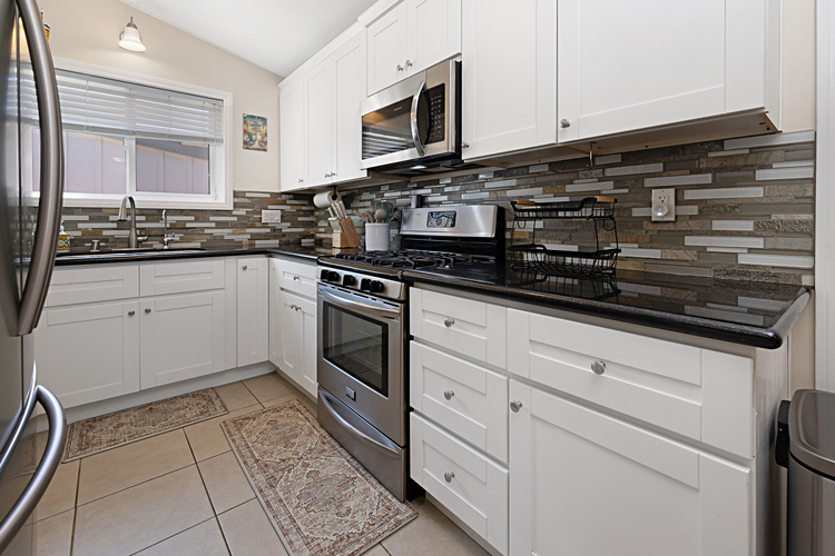 Kitchen equipped with gas stove and microwave