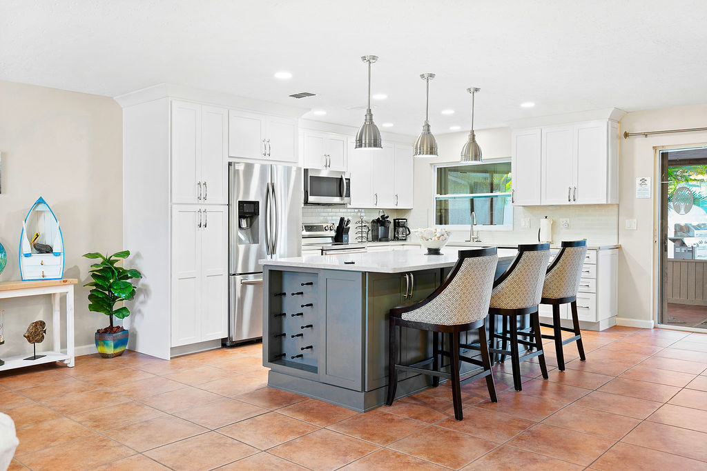 The large kitchen island lets the cook spend time with their family and friends.