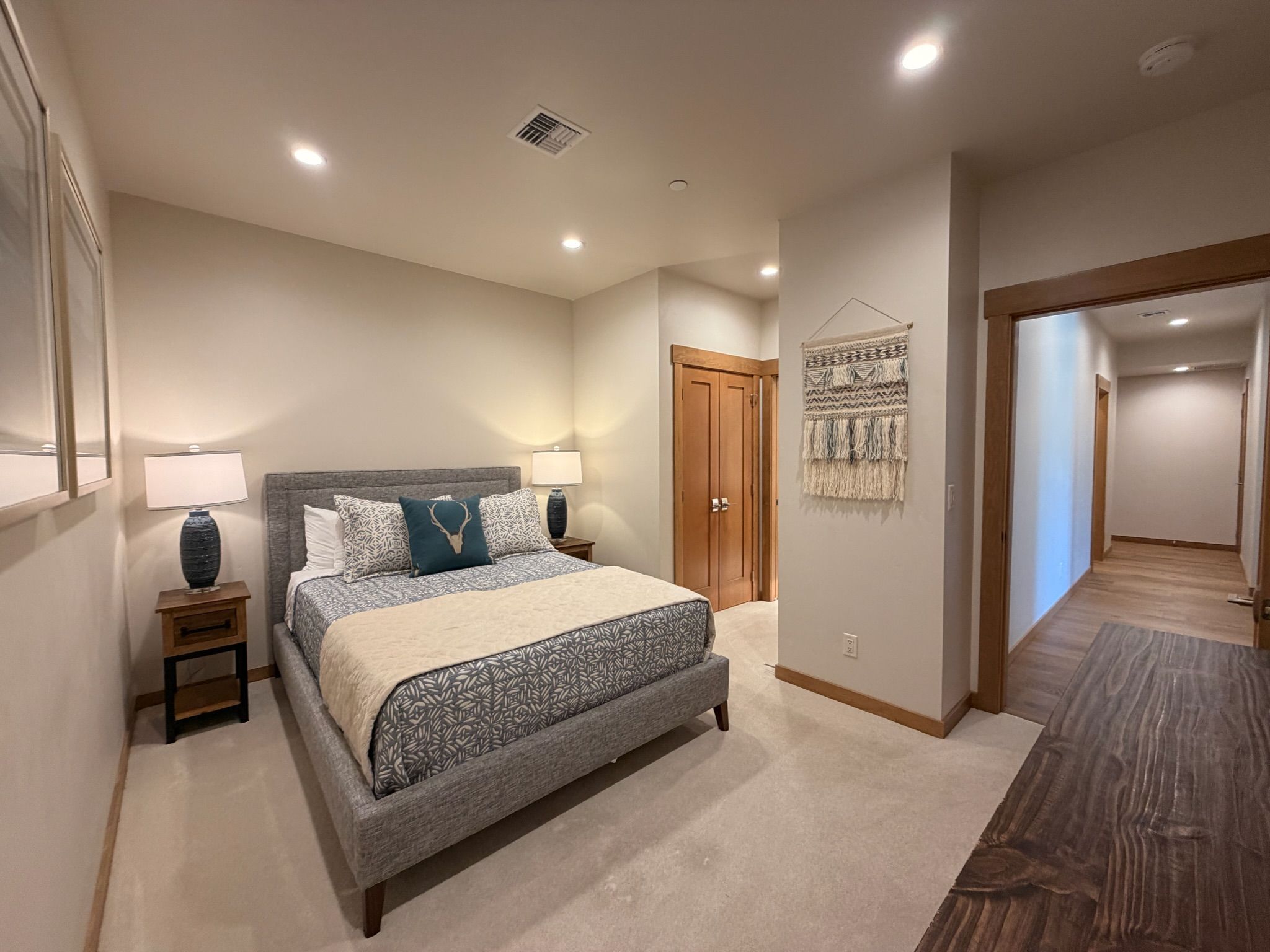 A serene retreat featuring upscale furnishings, soft textures, and modern mountain-inspired décor