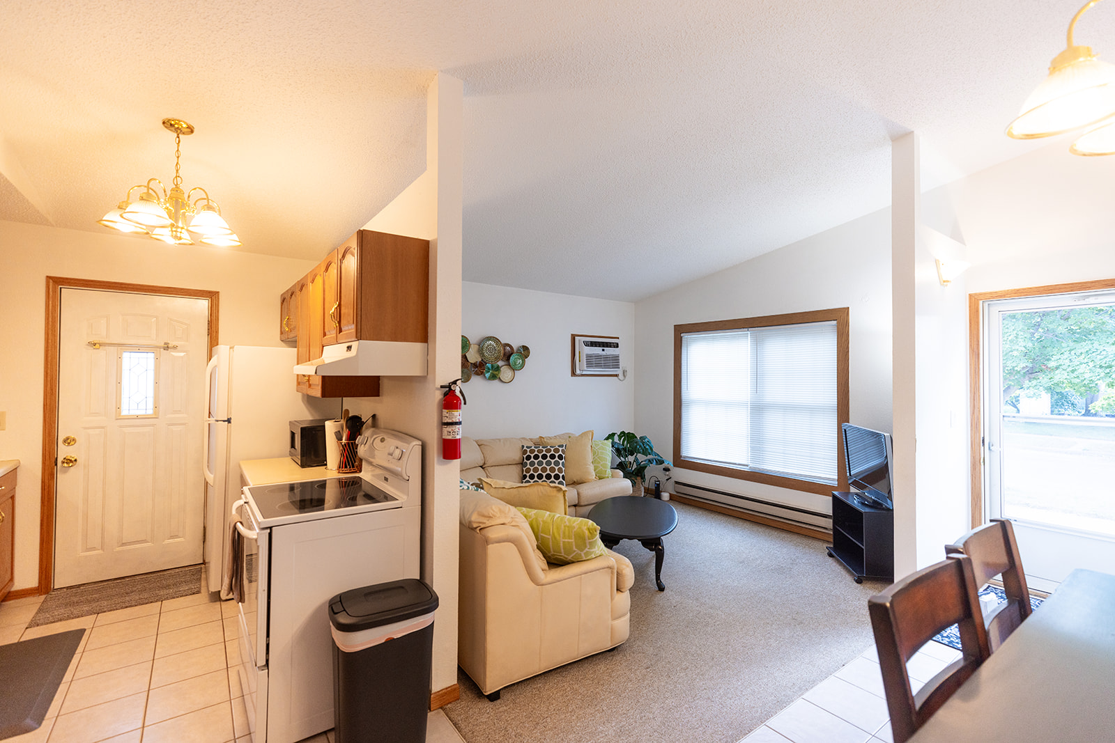 Galley kitchen opens to living room