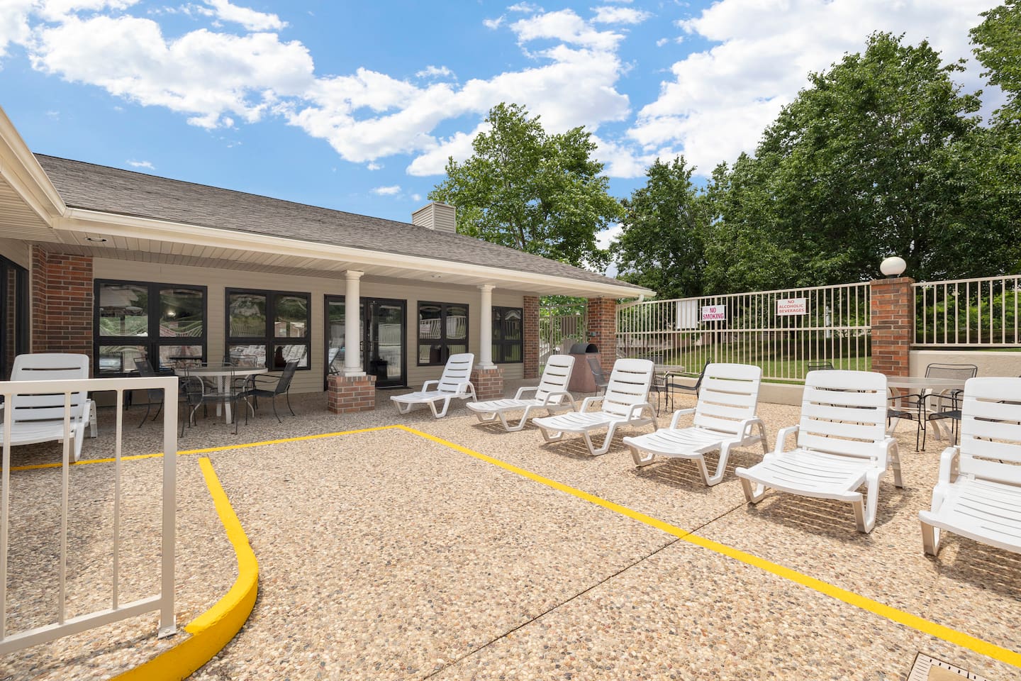 Outdoor Lounge Area: Relax under the sun in style, surrounded by lush greenery and inviting seats!