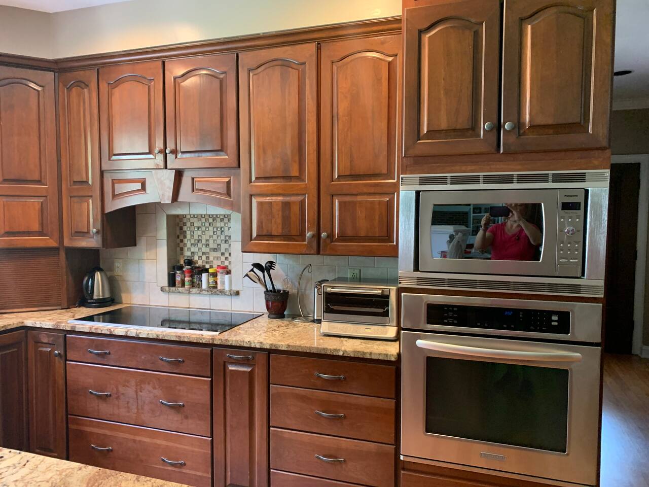 Kitchen close-up of Range, oven, microwave oven and toaster oven. 