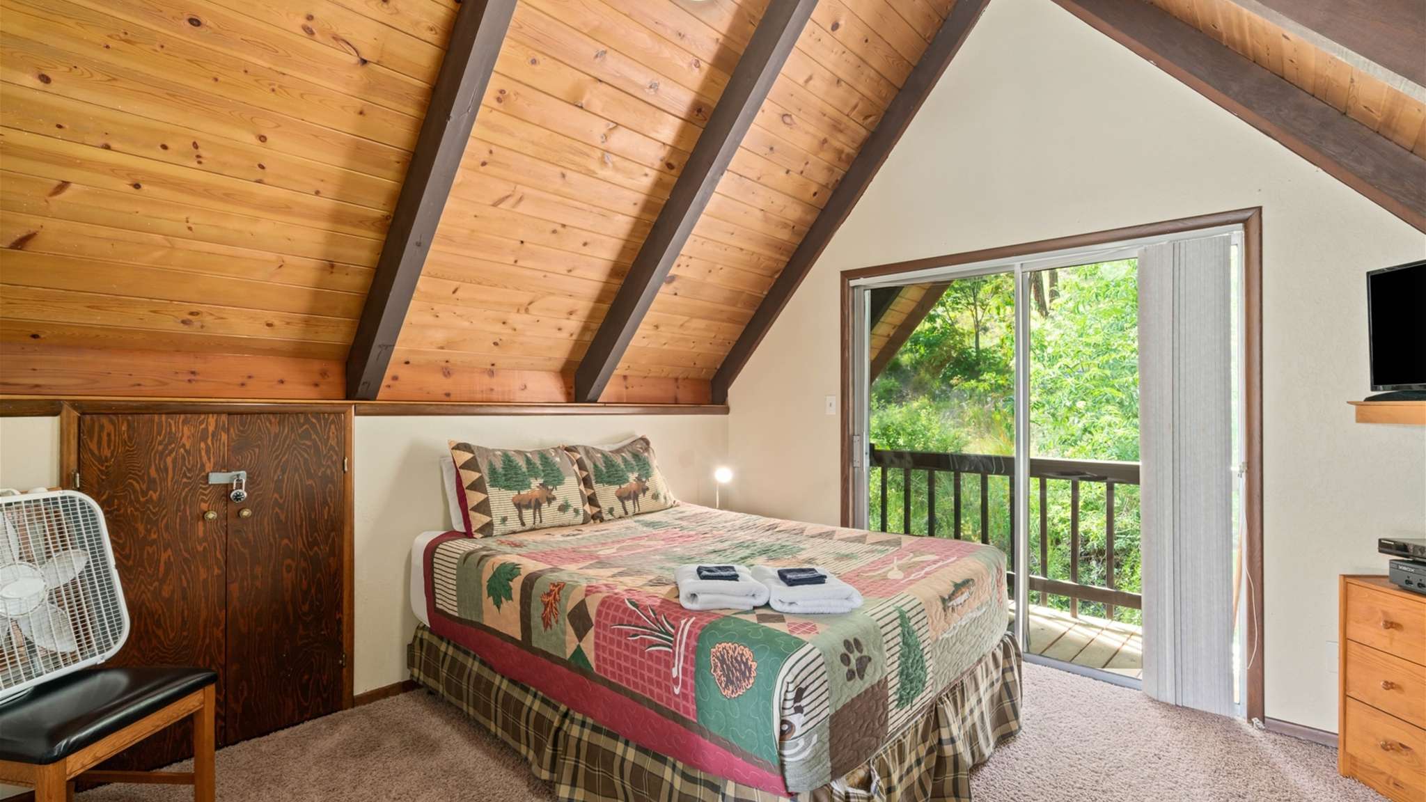 Upstairs loft with extra sleeping space and cozy cabin vibes.