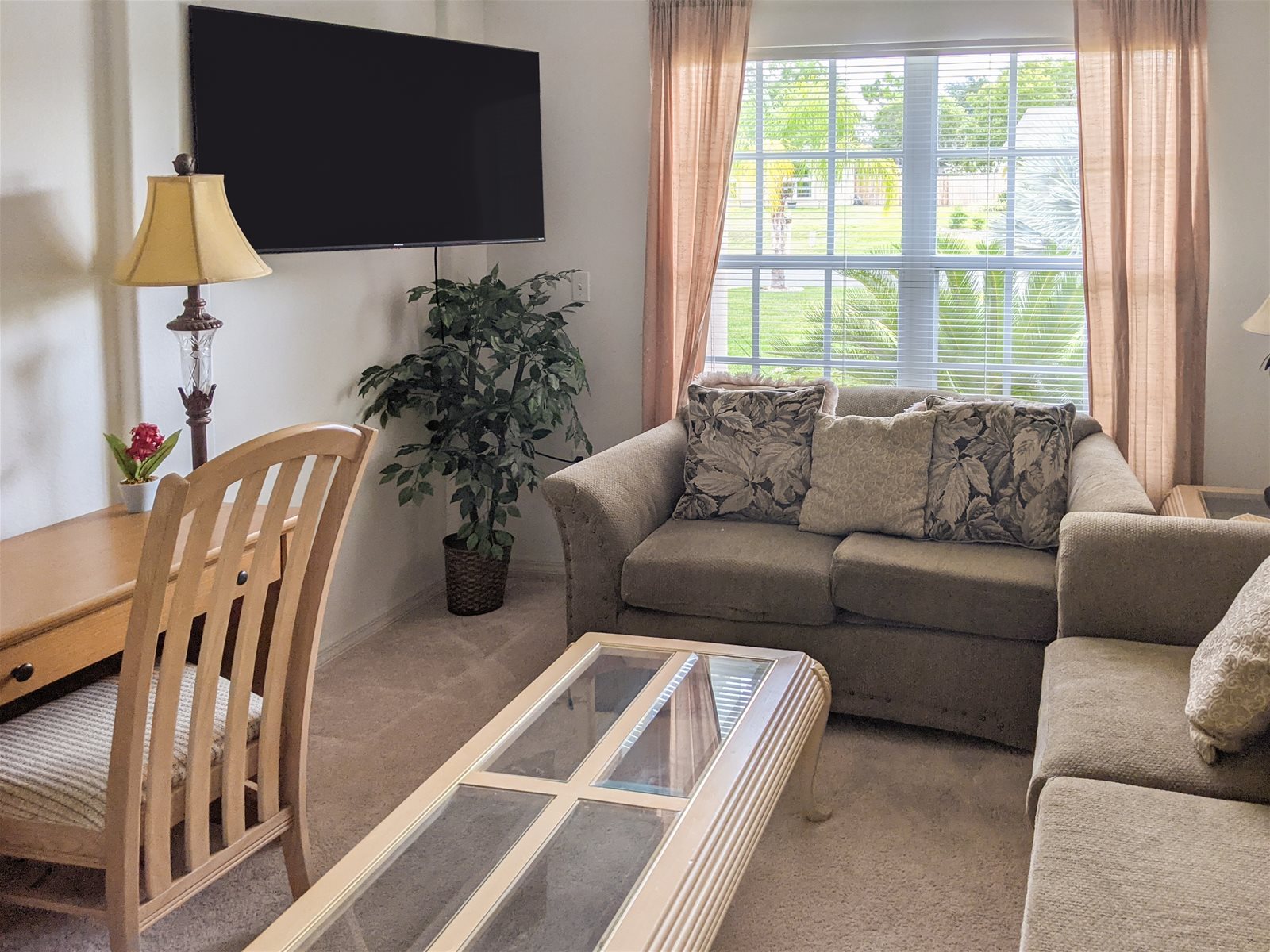 The Den with large screen TV and office desk.