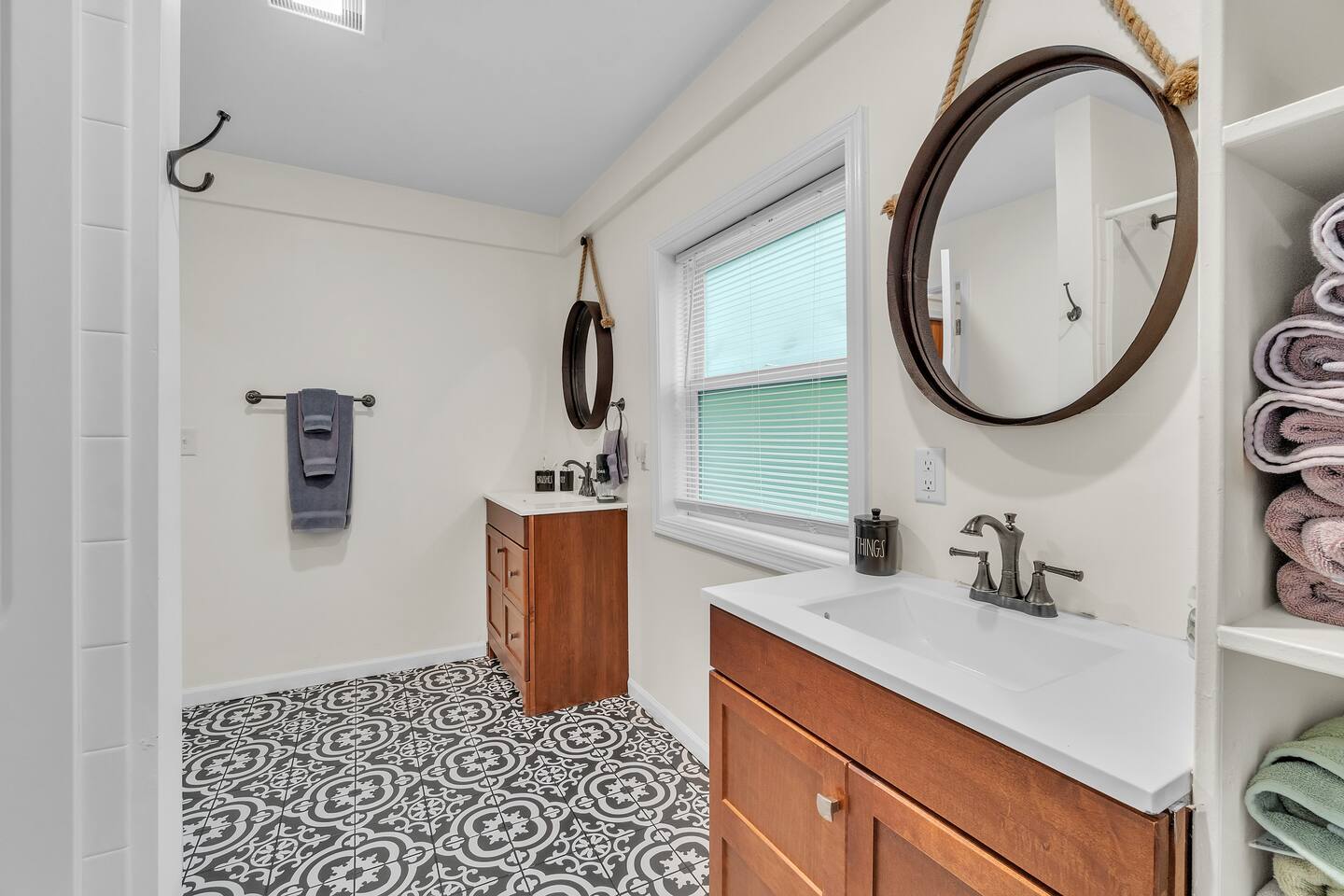 Enjoy the convenience of having a double vanity in the master bathroom, which also comes with the unique tiles, adding an extra layer of charm to this lovely home.