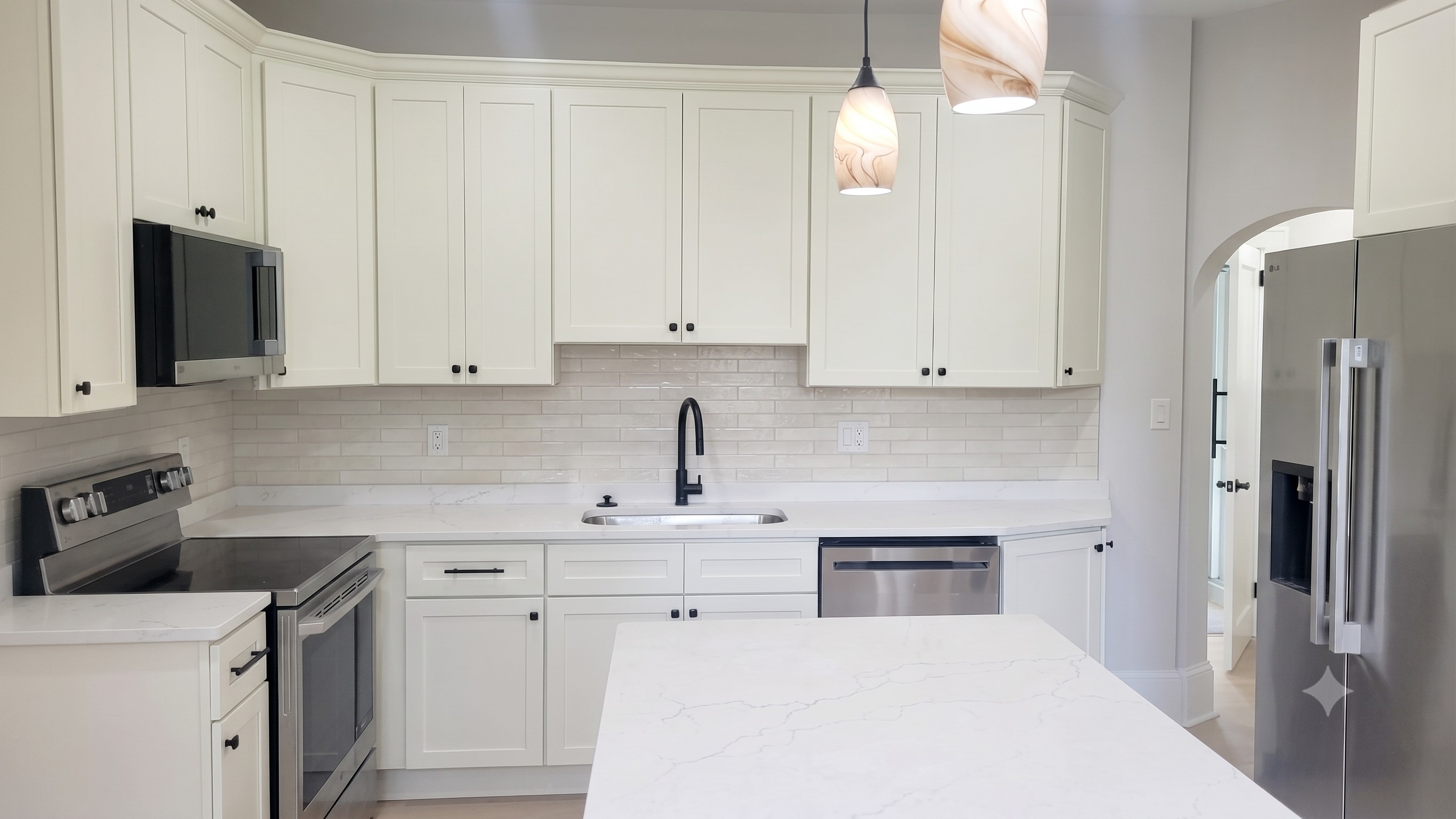 Chef's kitchen with real wood cabinets, stainless steel appliances, and all the supplies needed to feel like home