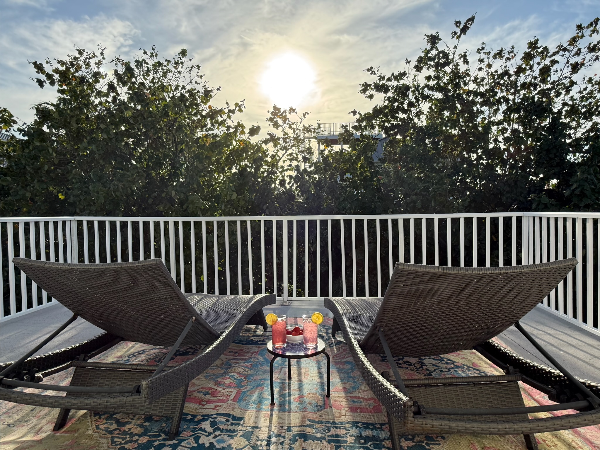 Relax off of the Primary balcony and watch as the sun fades behind the trees