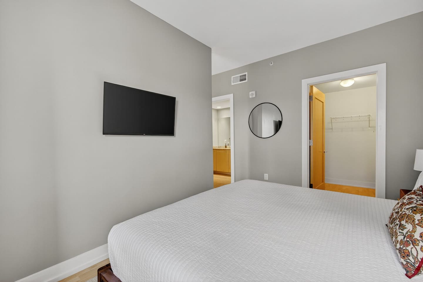 Kick back in bed while streaming your favorite shows on the wall-mounted TV. Just steps away, a walk-in closet keeps your stay organized; blending style and practicality for a seamless downtown getaway.