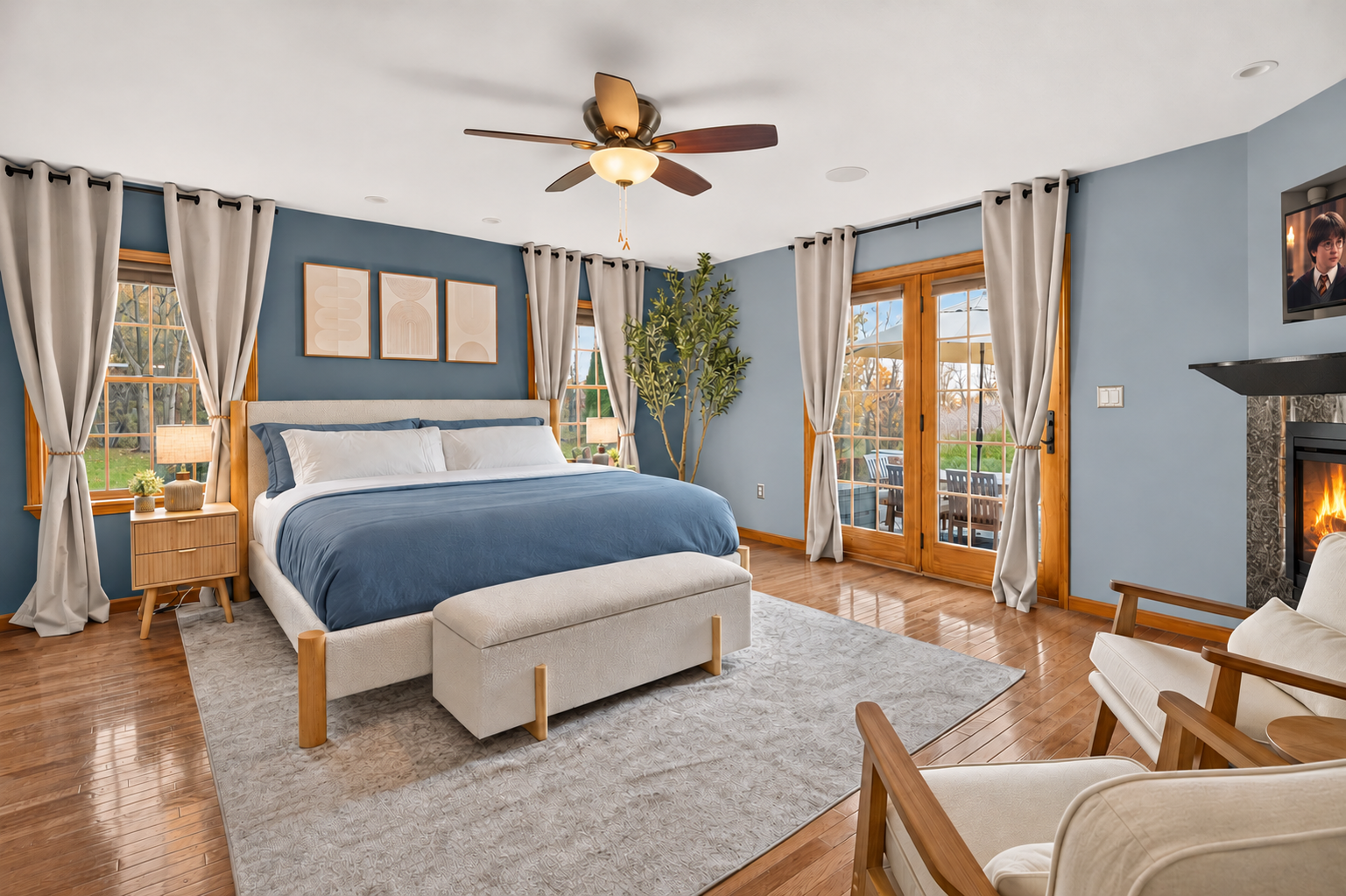 Bedroom with blue bedding and glass patio doors