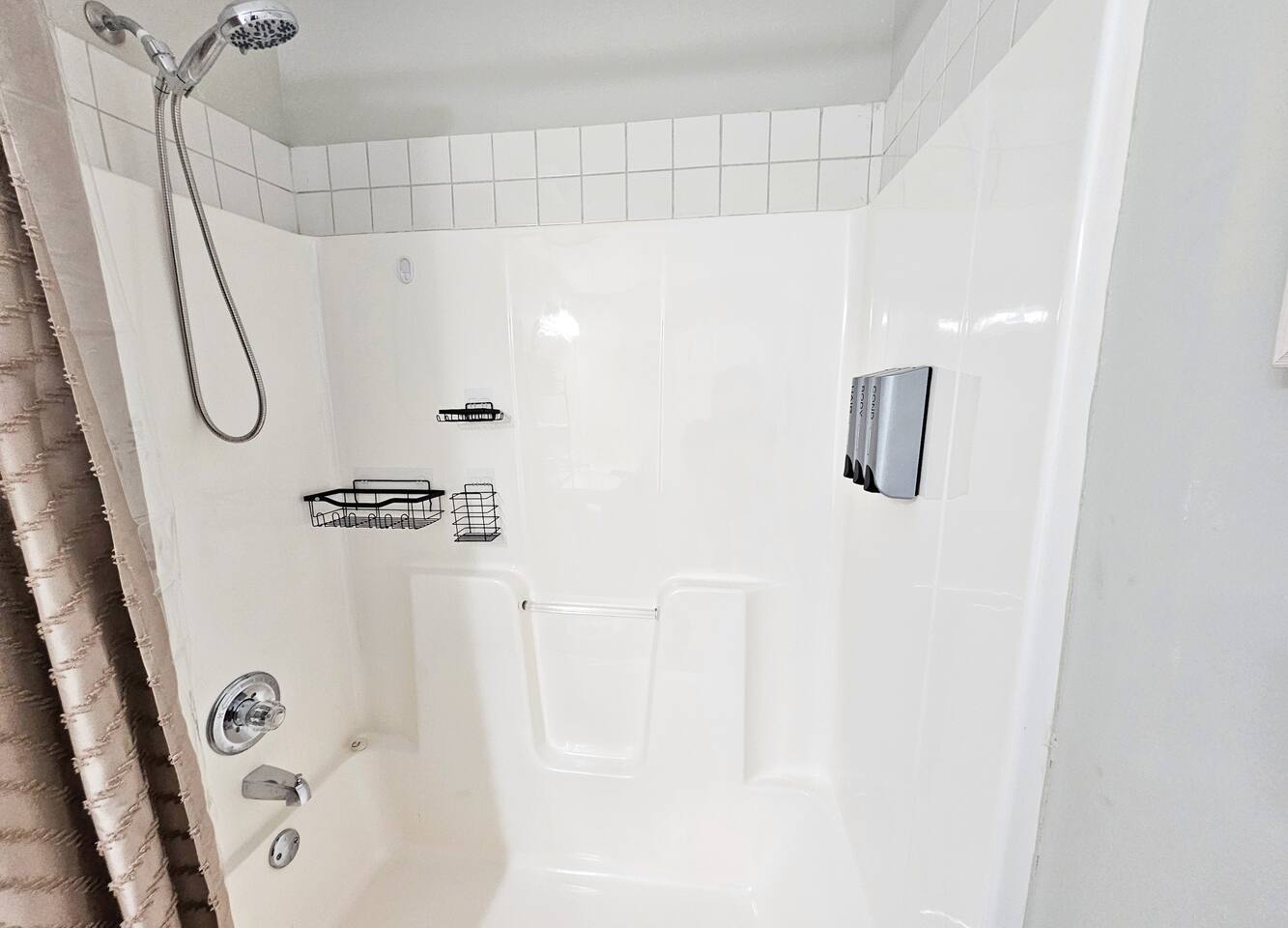 Brand new spa handheld shower head and dispensary. Plenty of in-shower storage as well. 