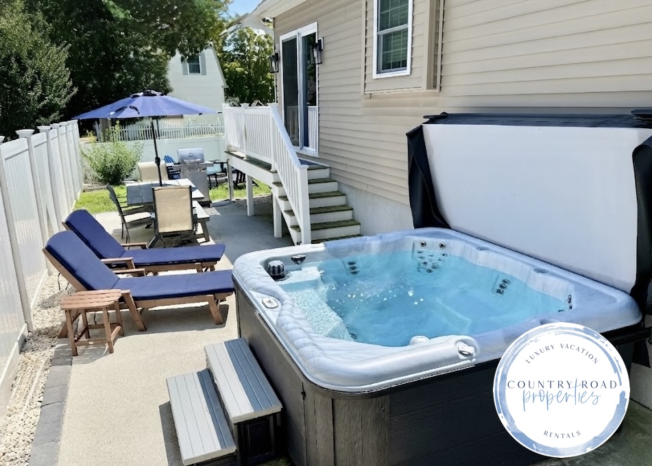 Nothing beats a long soak in the hot tub after a day at the beach! This patio is a true vacation oasis, featuring bubbling jets, comfy lounge chairs for sunbathing, and a nice shaded table for outdoor dining.