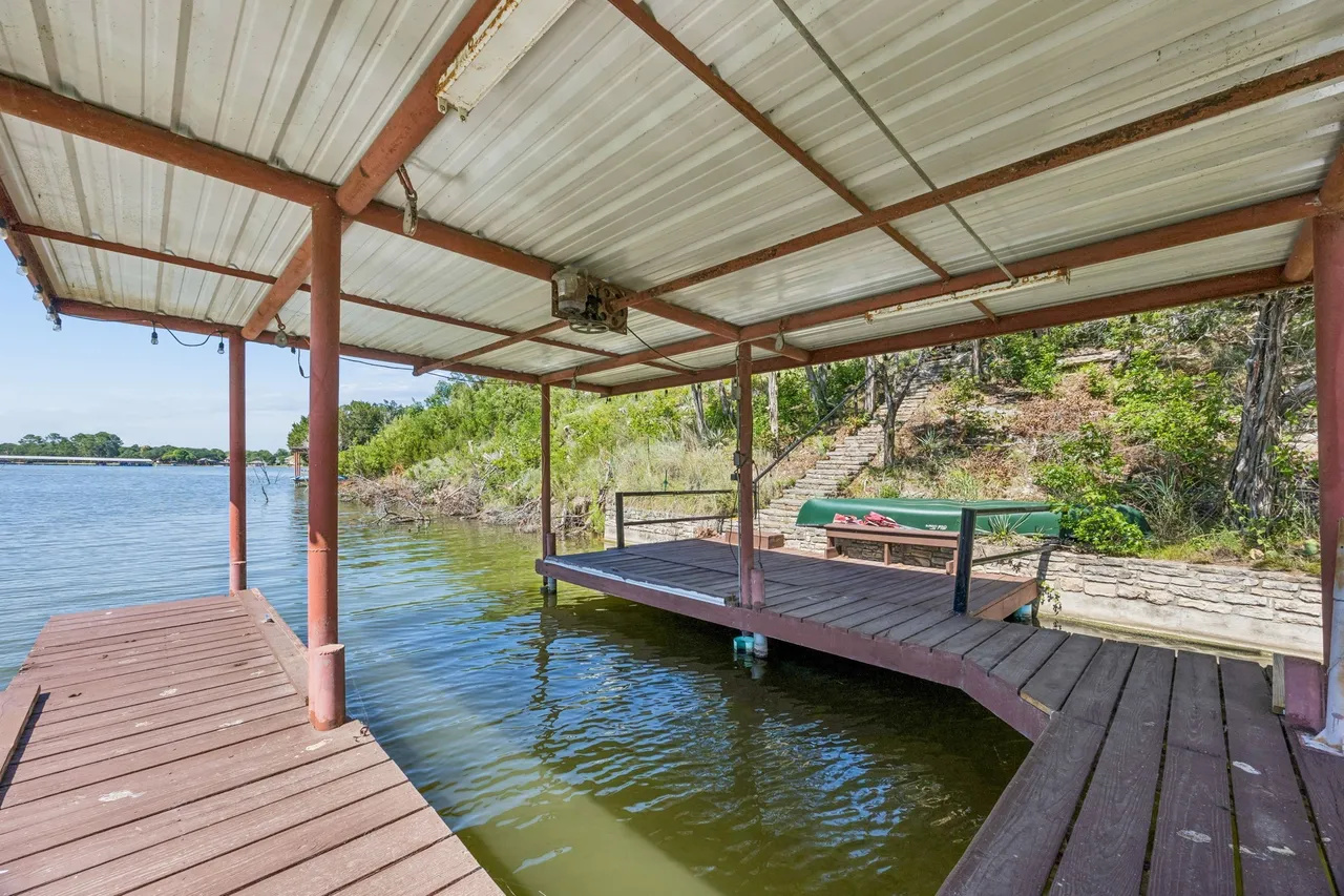Covered dock with room to relax by the water.