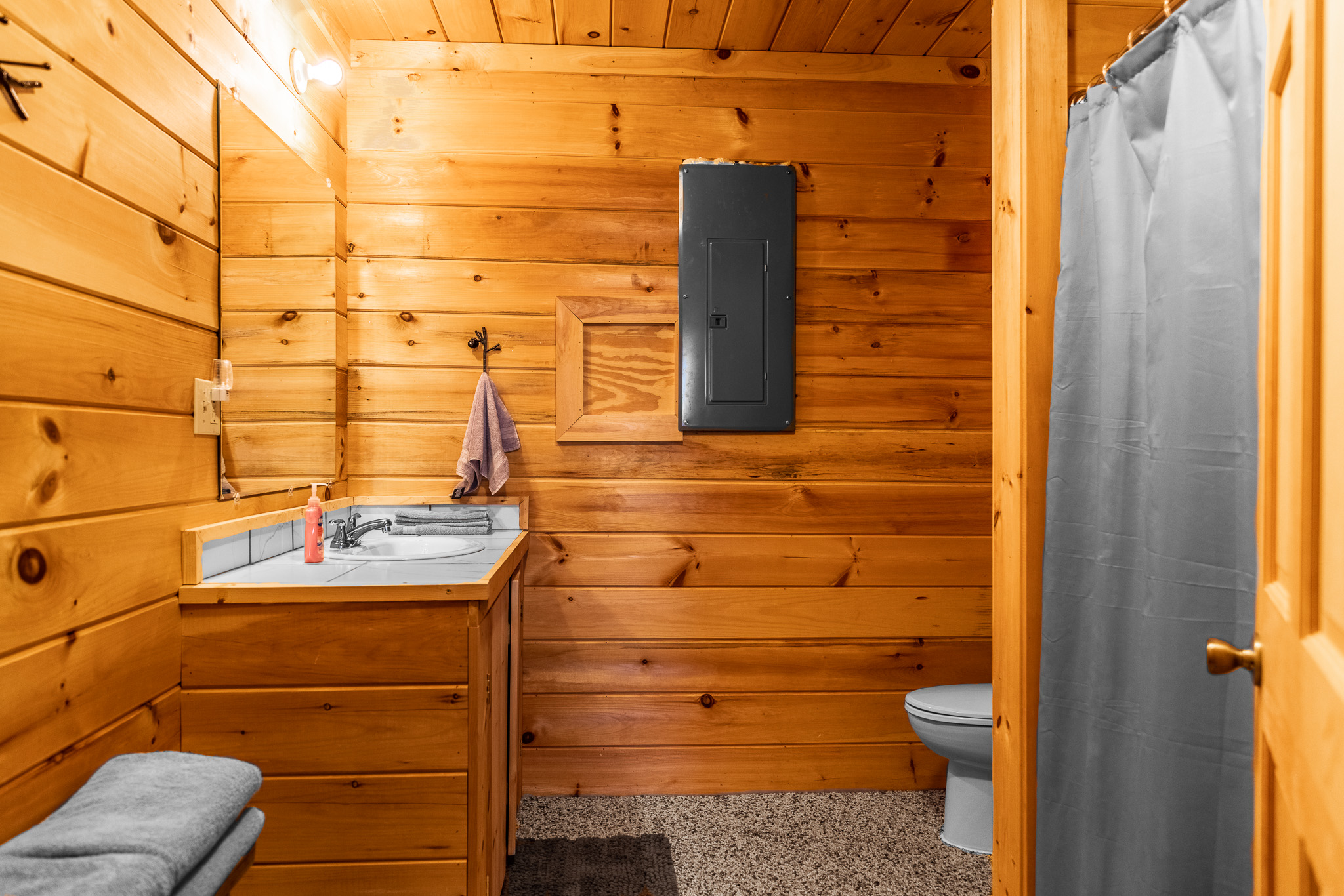 Full bathroom attached to your downstairs suite with 2 queen beds. 1 of 5 full bathrooms in the house.