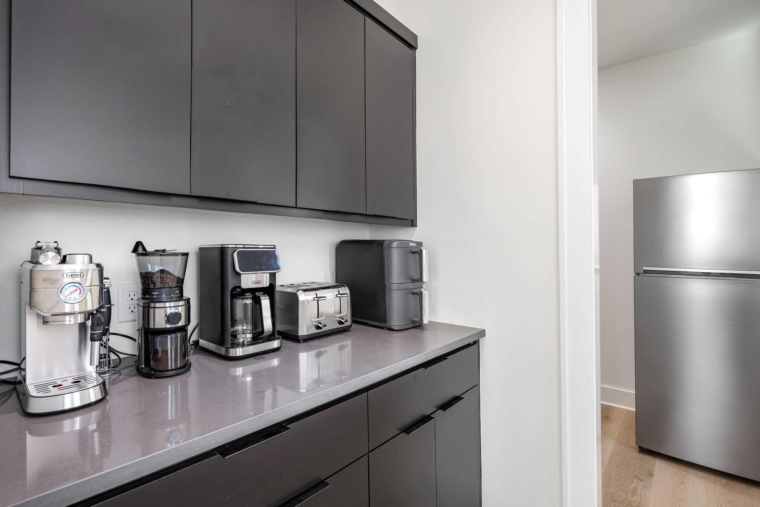 The coffee and snack station includes everything you need to start your morning right—from espresso to toast.