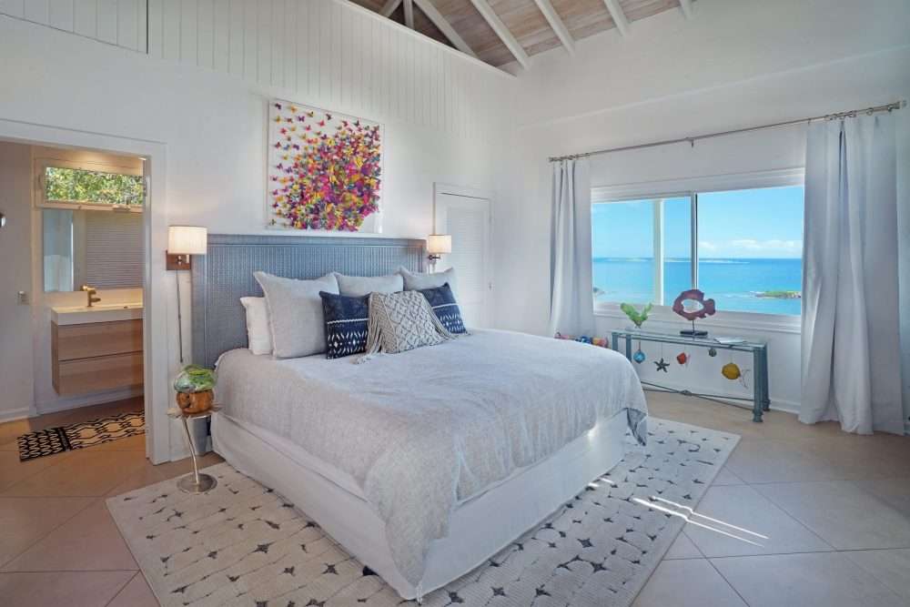 Primary bedroom located right past the office and ensuite bathroom.