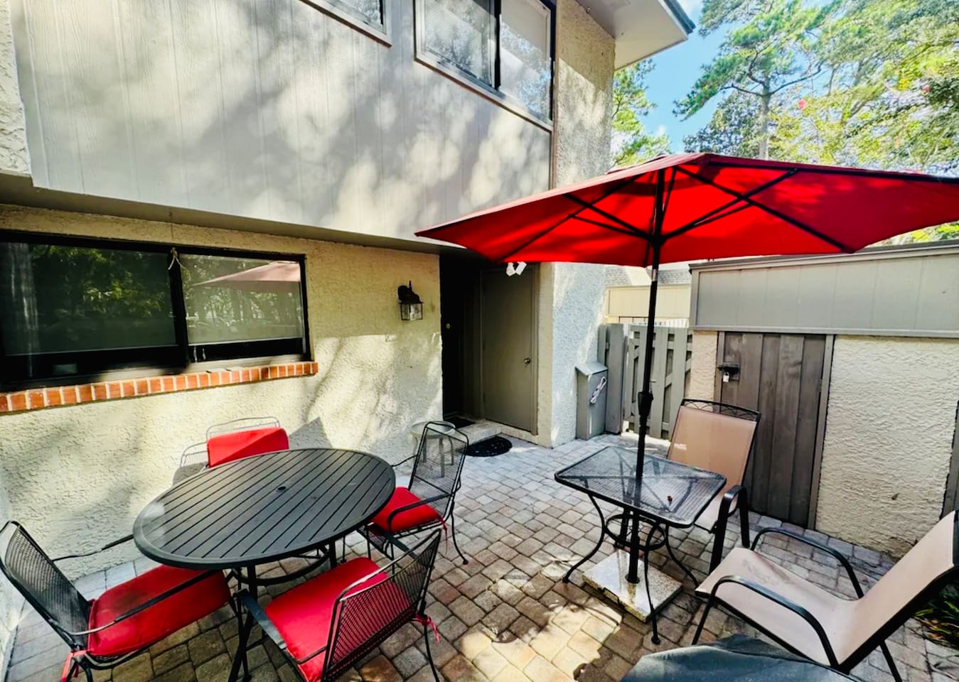 Private patio with umbrella and seating