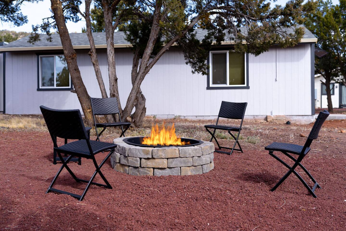 Cozy up by the crackling firepit, surrounded by whispering juniper trees and open skies! Whether you're roasting marshmallows, swapping stories, or just soaking in the warmth, this outdoor haven is made for magical moments and endless laughter!