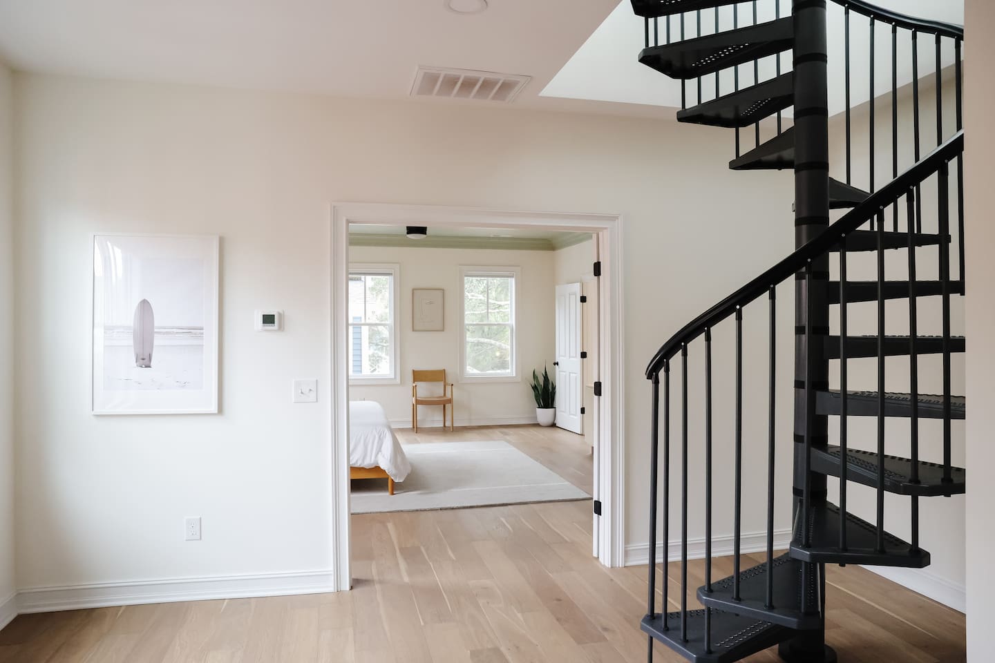 The primary bedroom is at the top of the landing with double doors. The landing provides additional space to get ready. 