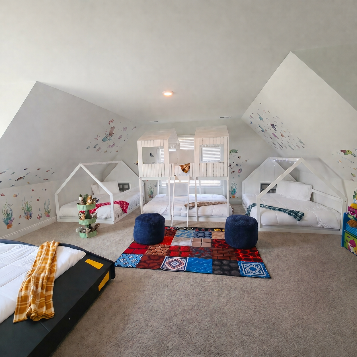 Kids Room: Imagination thrives in this vibrant space with fun house beds and playful decor!