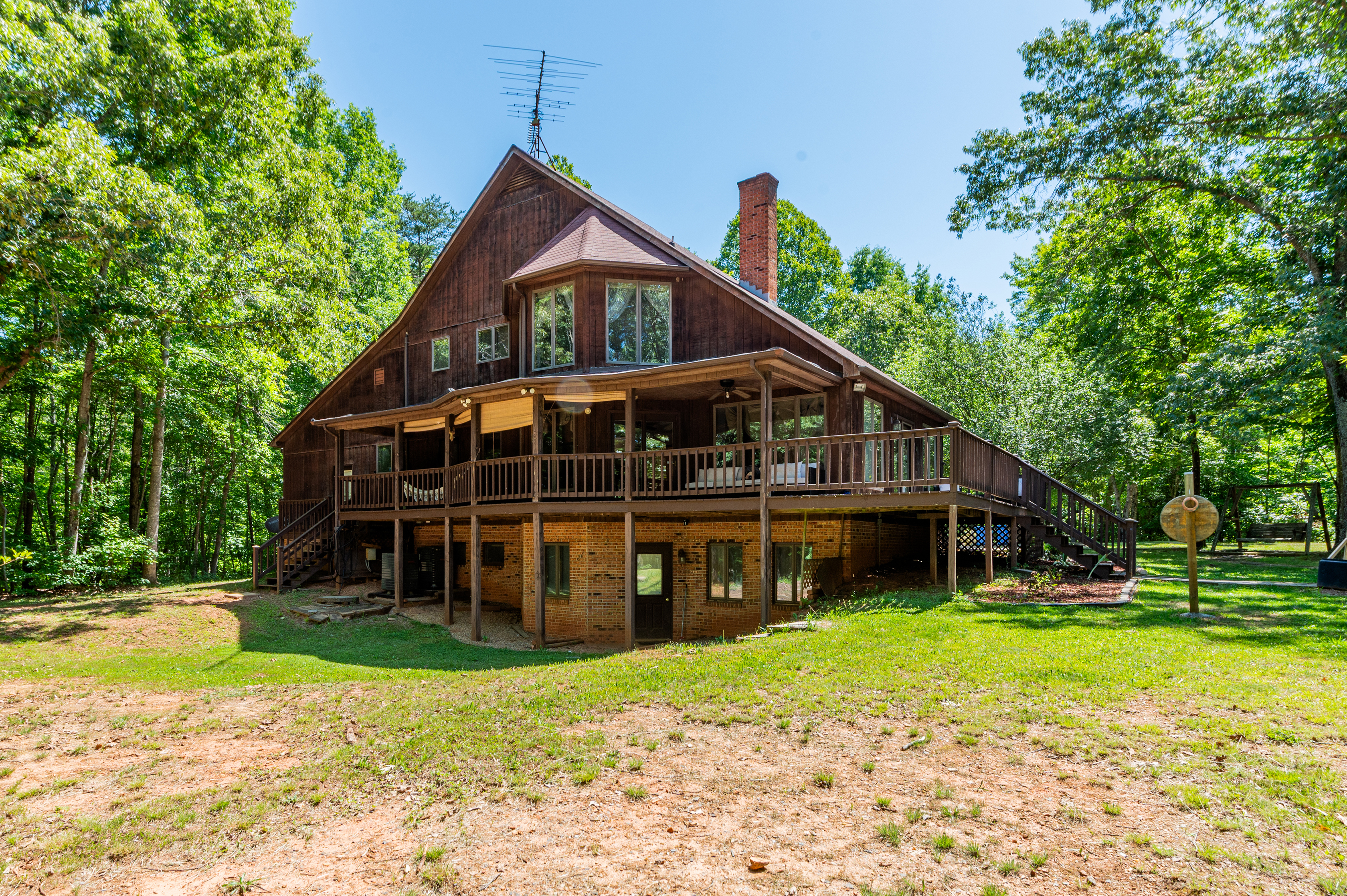 Exterior Retreat: Relax on the spacious deck surrounded by lush greenery and fresh air!