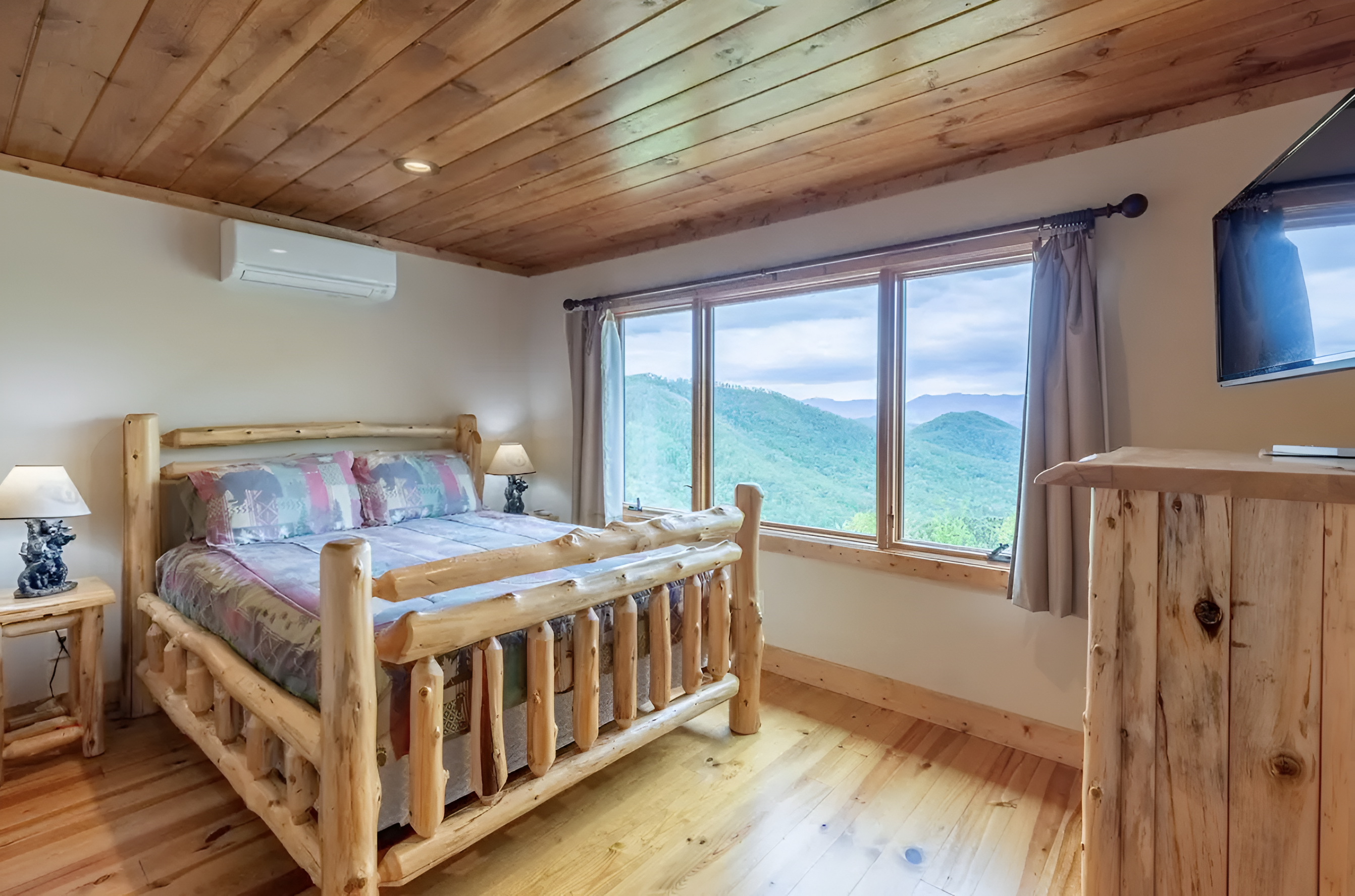 The upper level queen-sized bedroom has great views and a personal TV.