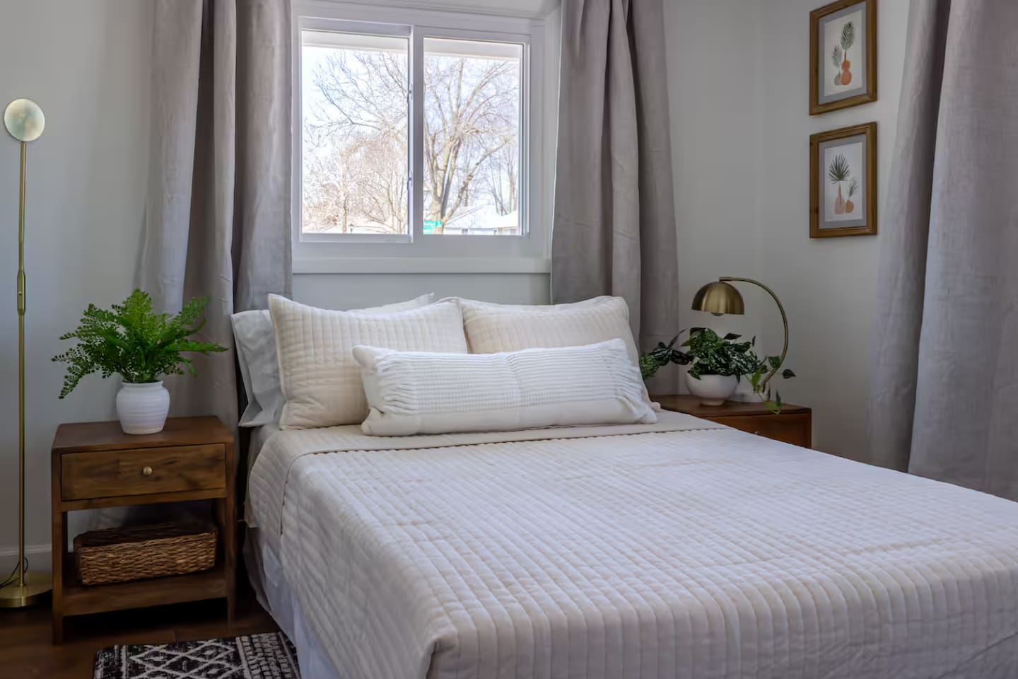 Crisp white linens and morning light streaming in make this room an easy place to sleep in.
