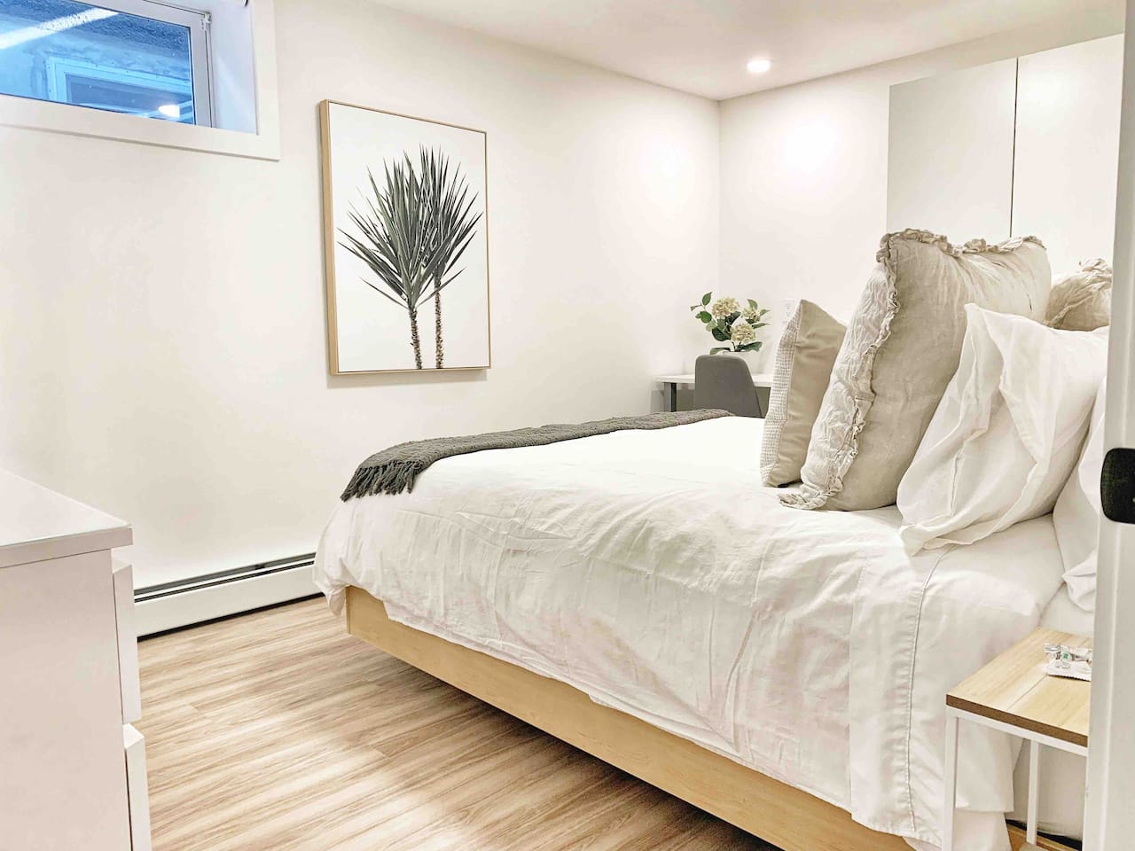 Comfortable queen bed with quality linens designed for a good night’s sleep.