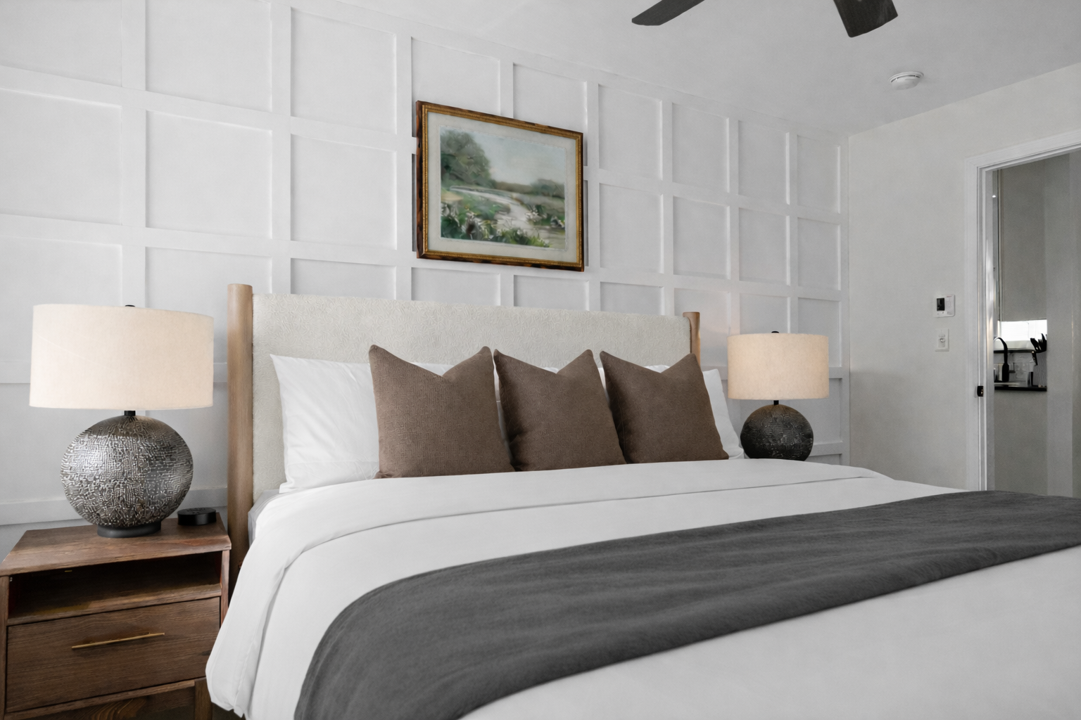 Elegant bedroom with plush king bed, soft lighting, and a stylish accent wall—offering a peaceful, hotel-like retreat for a great night’s sleep.