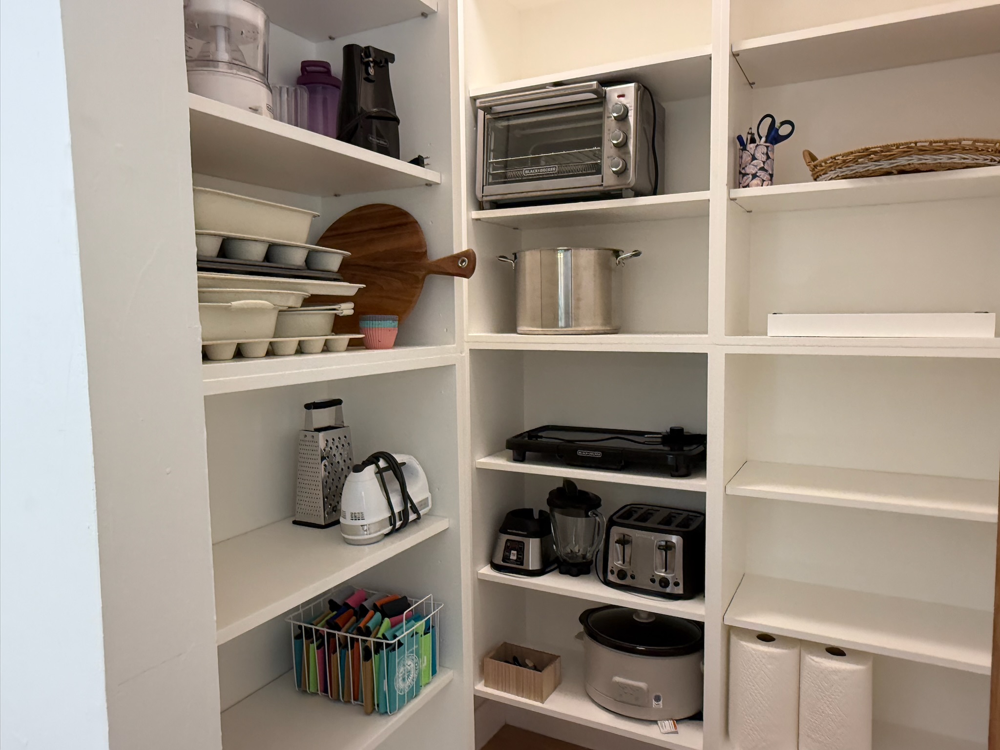 Large pantry provides small appliances and ample space to keep groceries organized