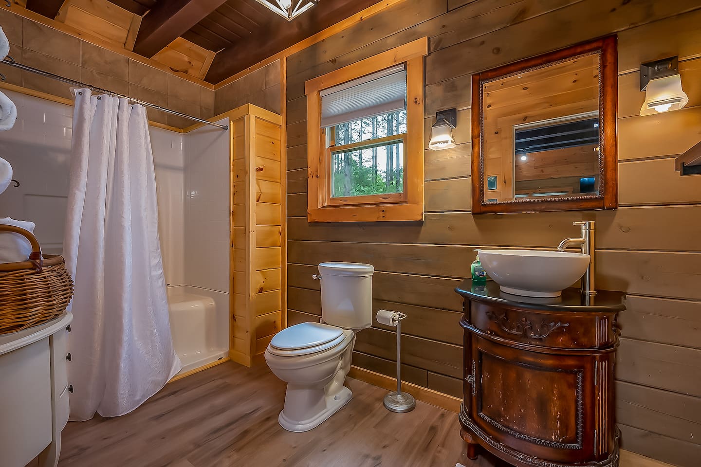 Main floor bathroom with large walk in shower. There are 5 steps to get to main level with a full bath and bedroom on main level.