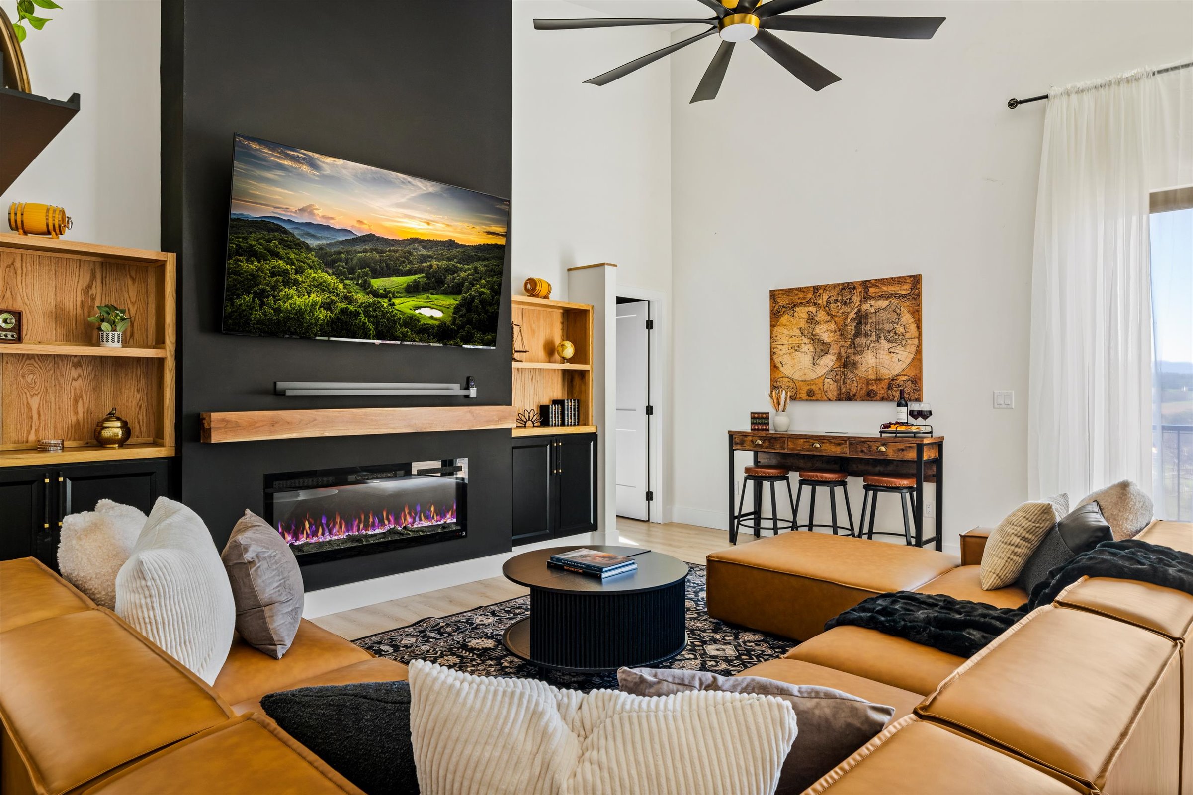 {Living Room}
Settle in for movie nights or the big game on the 75” TV — leather sectional seating, fireplace glow, and a space built for shared moments, from kickoff to late-night films.