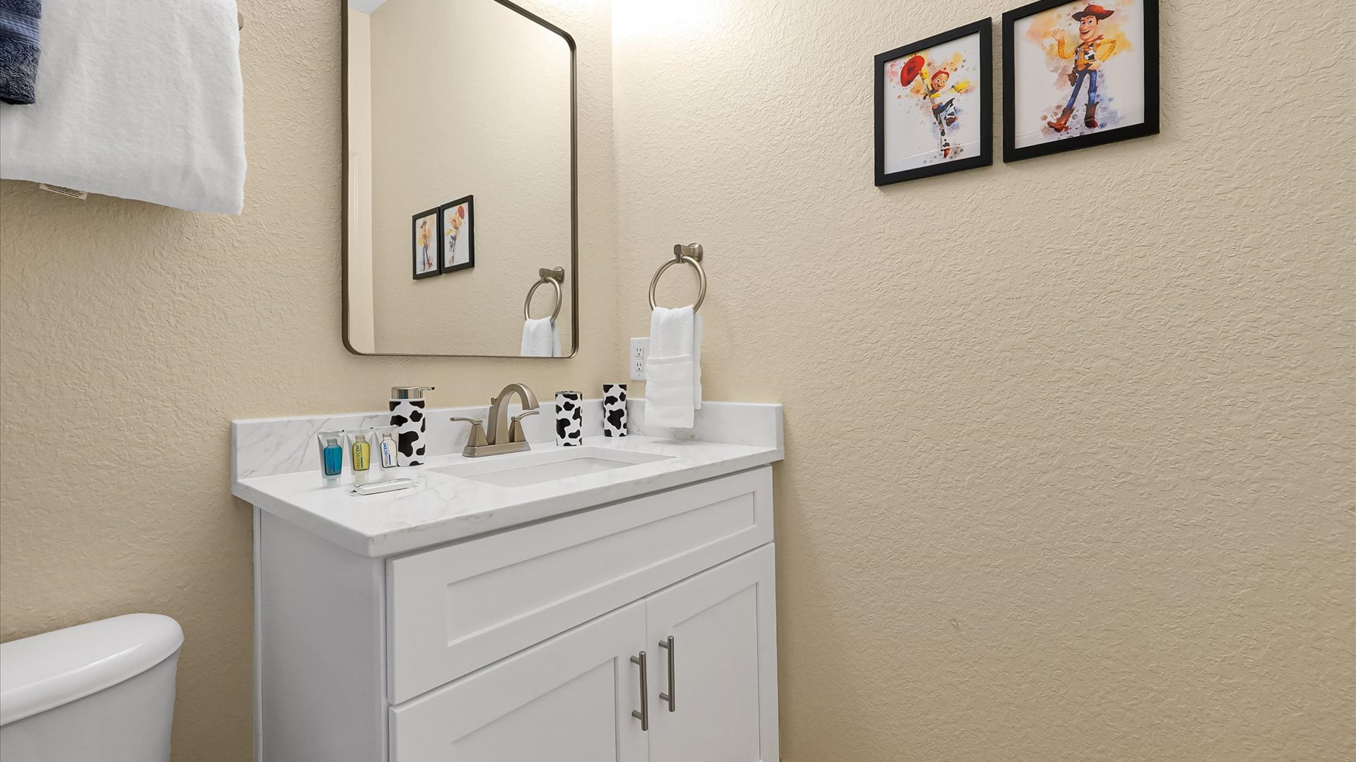 Toy Story Ensuite: Bright private bathroom with a modern vanity and shower for Toy Story Adventure guests.