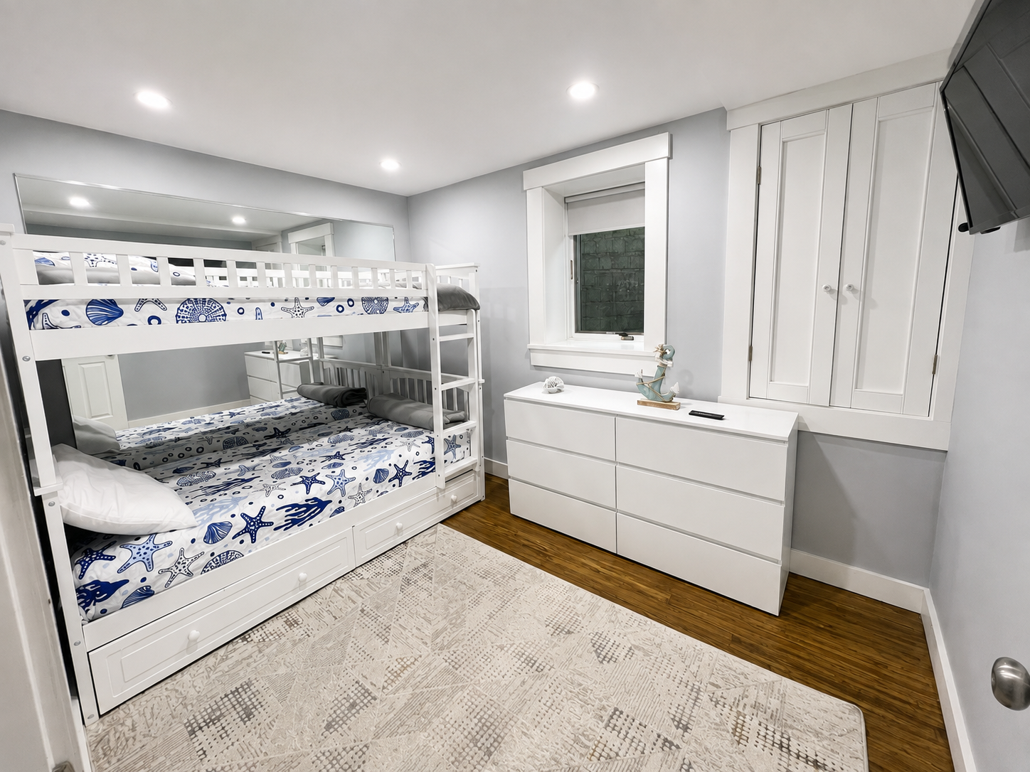 Bedroom 4 (basement) with bunk bed and smart TV