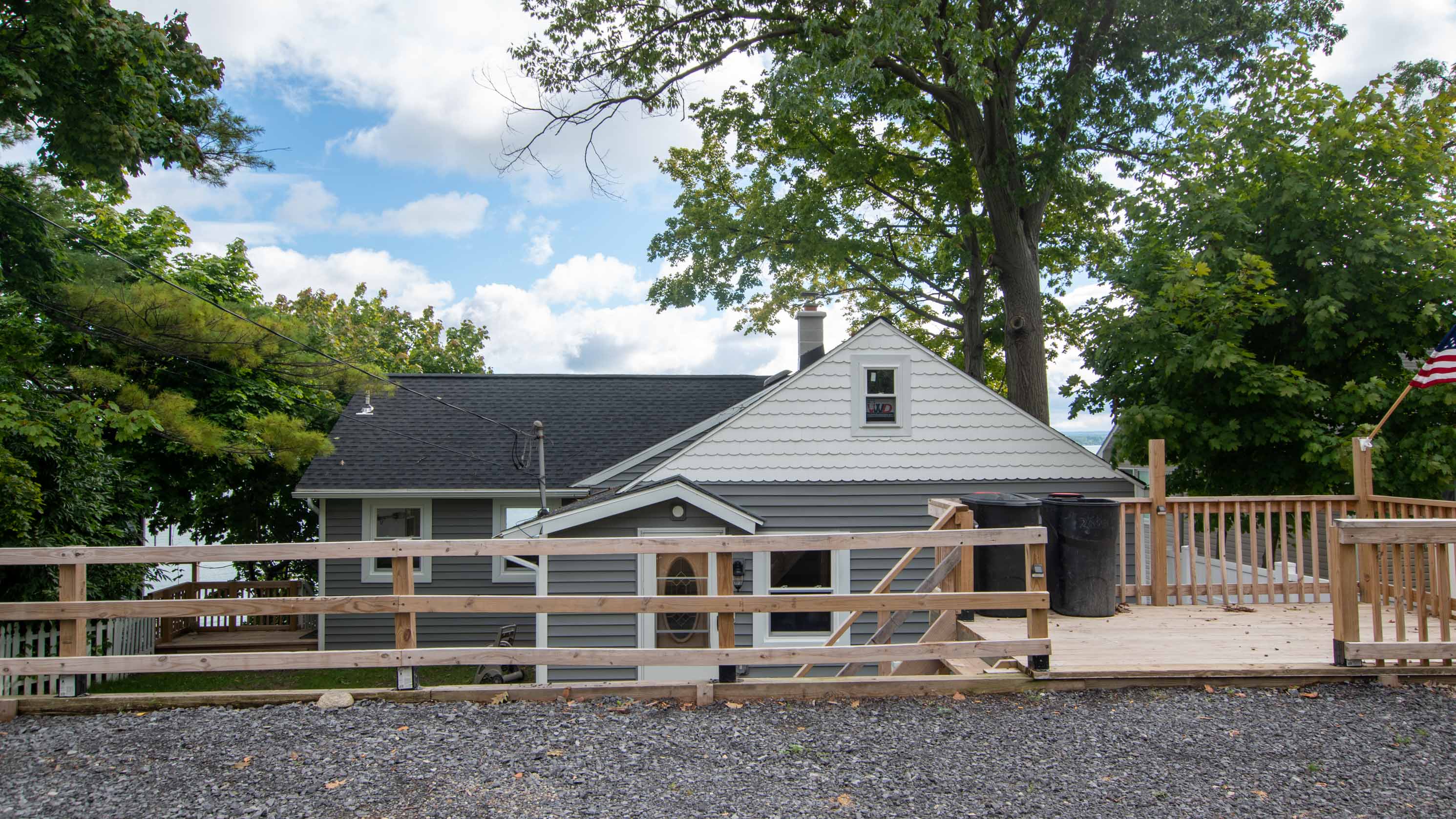 Private exterior view showcasing outdoor living and deck access