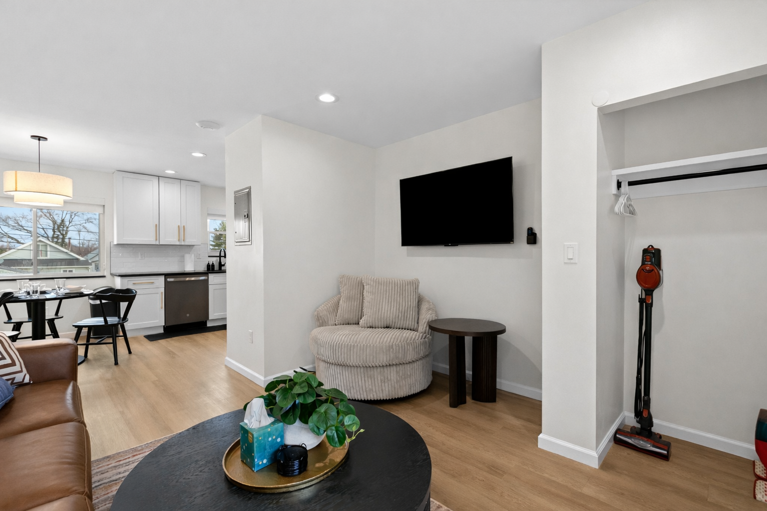 Open-concept living with modern finishes, cozy seating, and a smart TV—seamlessly connecting the kitchen and lounge for easy, comfortable stays.