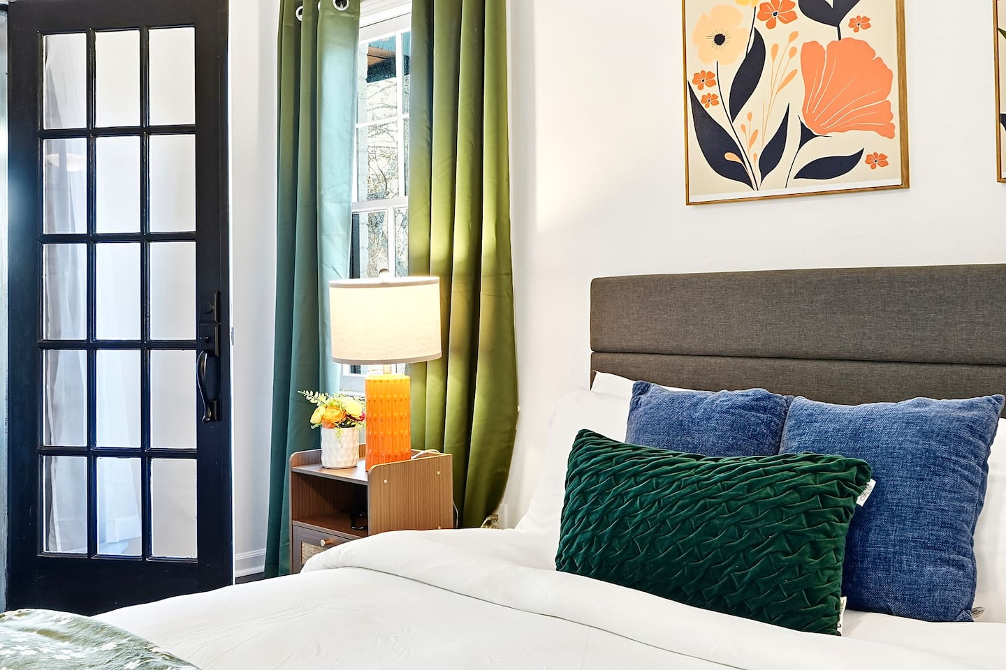 Spacious first-floor master bedroom located to the far right as you enter through the front door. This earthy, calming retreat features a king bed and smart TV. This room includes 2 full-body towels, 2 washcloths, and 2 hand towels for your stay.