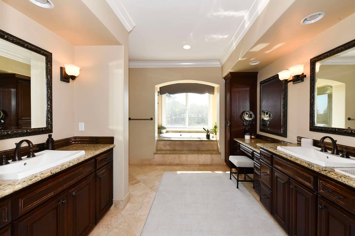 Primary bathroom with jacuzzi and shower.