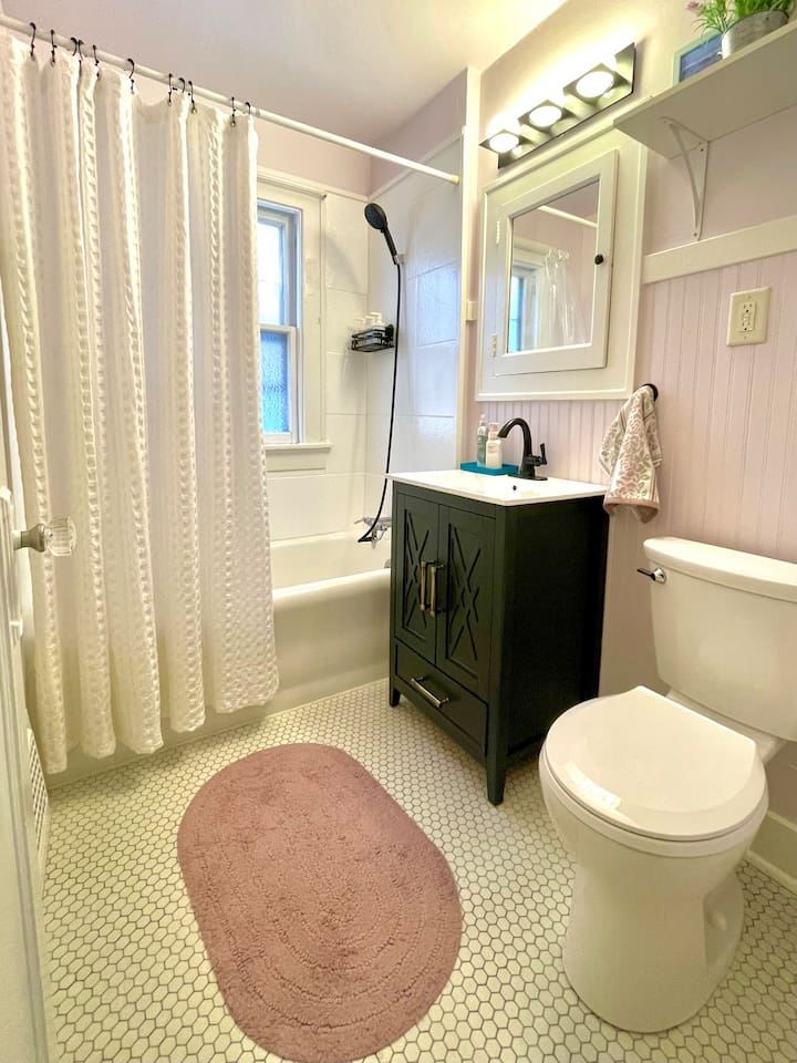 Charming bathroom with original tile flooring and fresh, modern updates.