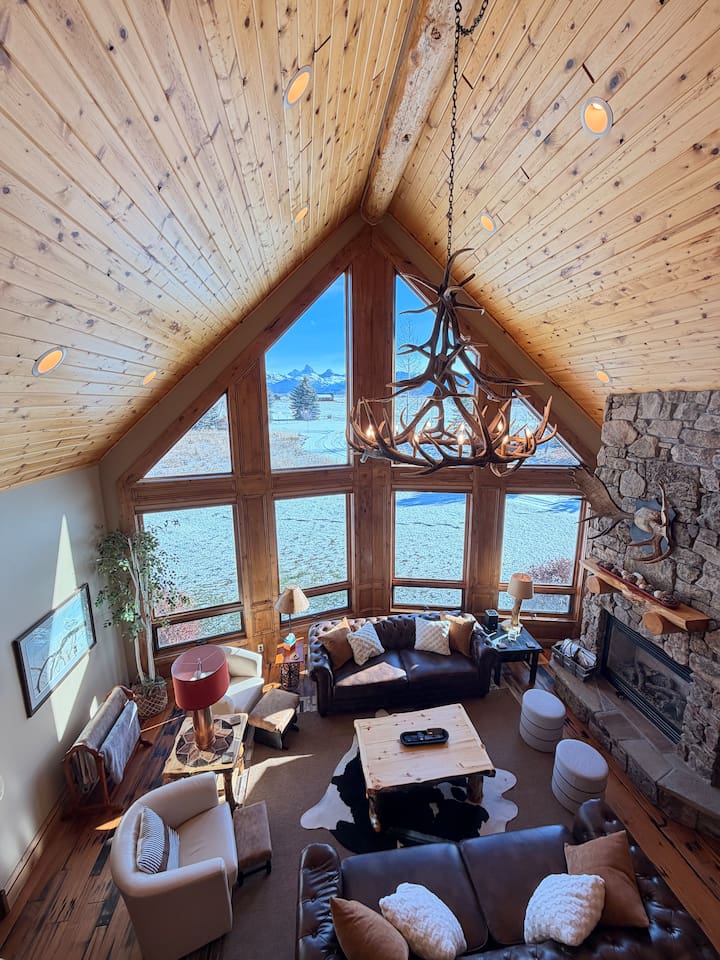 Experience the heart of the home in this breathtaking great room!  The dramatic wall of windows, stone fireplace and cozy seating make it a perfect place to unwind and connect. As one of our guests said, ‘This house is a vacation unto itself!'