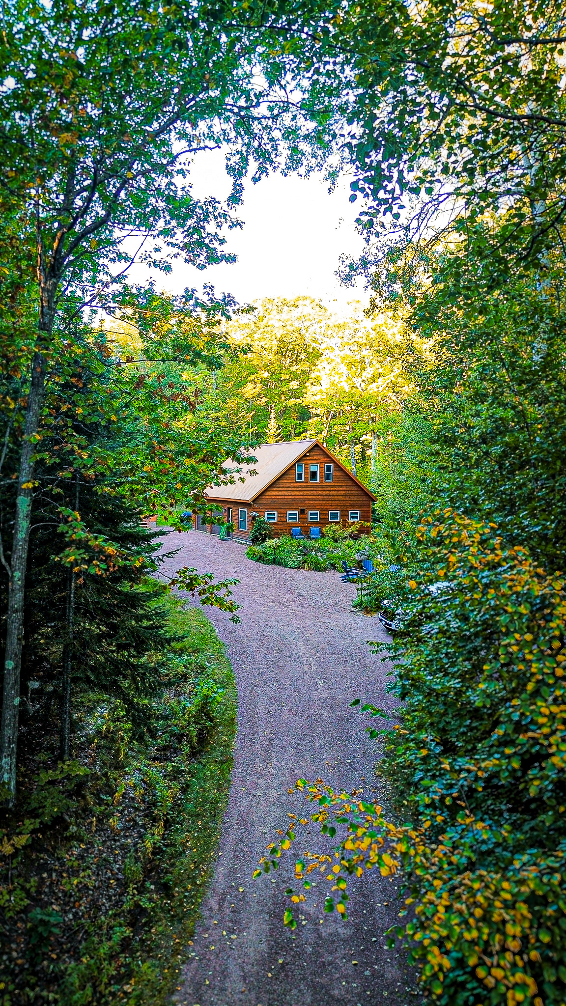 Rock Garden cottage view coming up driveway in early fall 