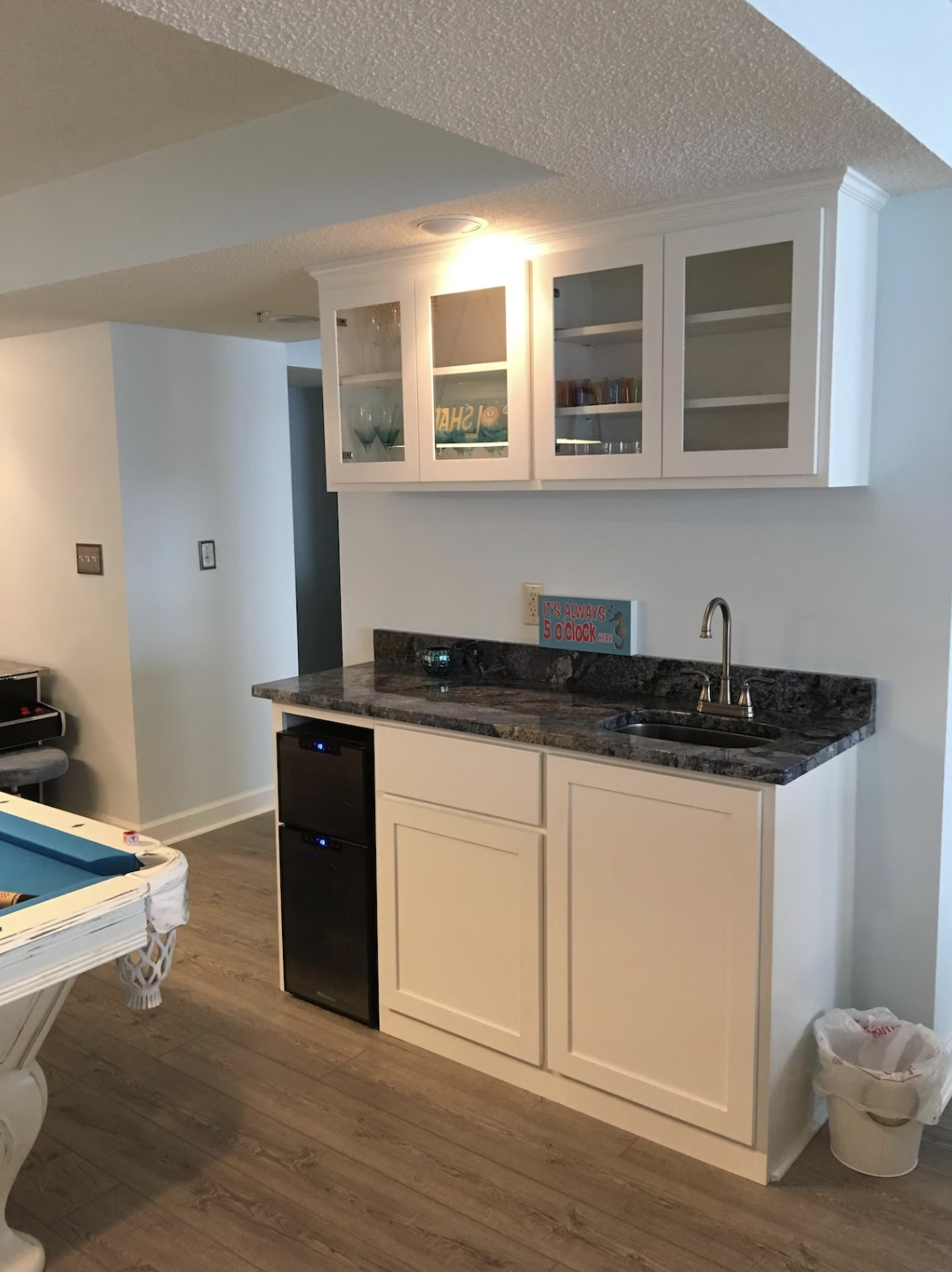 The game room and living area features a wet-bar for all your vacation cocktail needs!