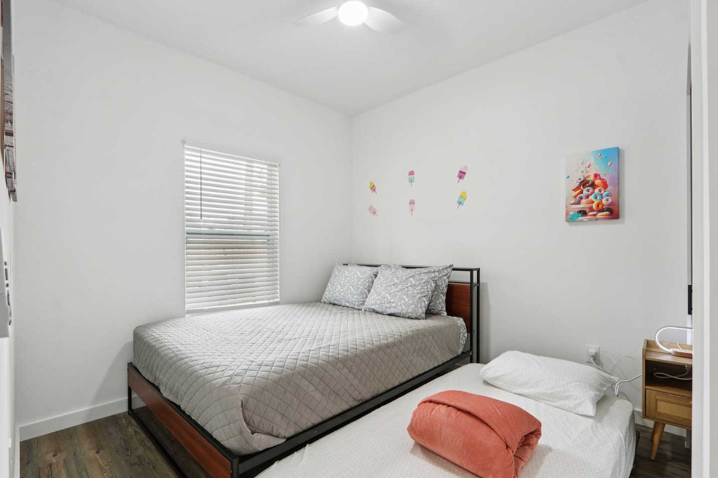 Bedroom has Queen Bed, twin trundle under bed, nightstand, suitcase holder, closet with hangers
