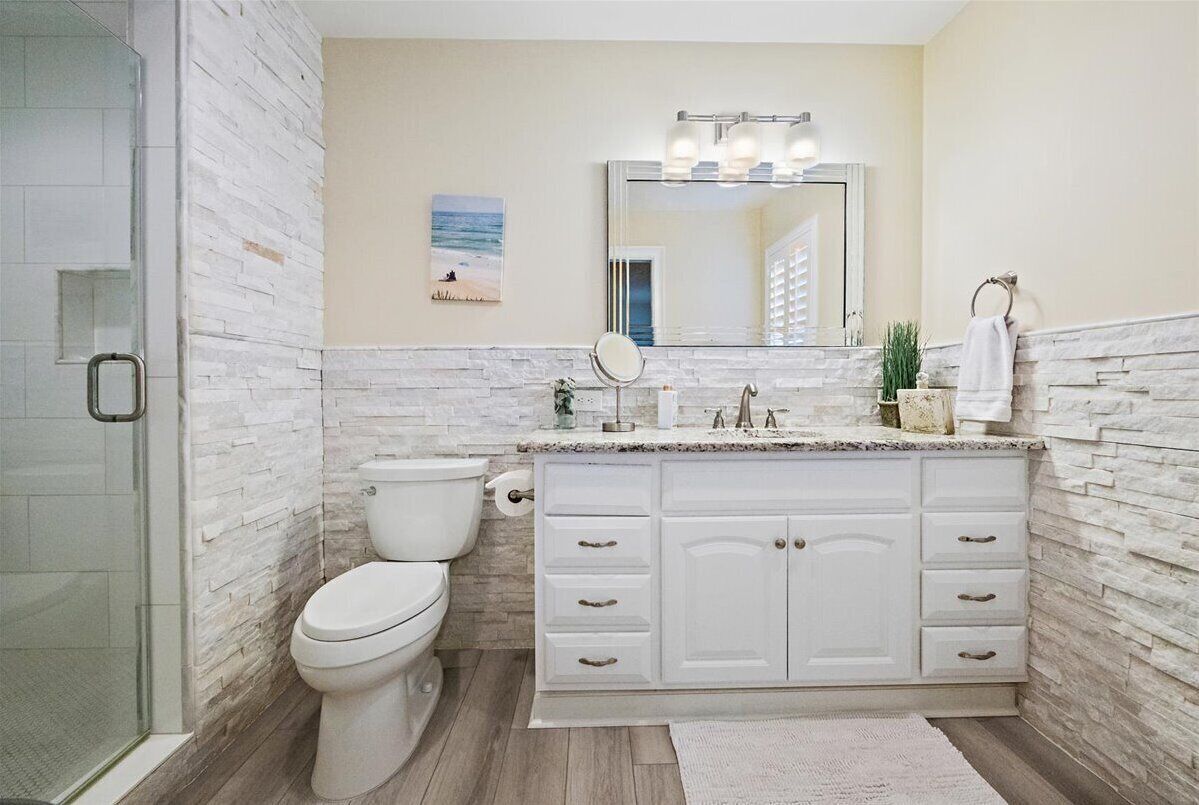 Double queen bedroom has private bath with large shower stall.