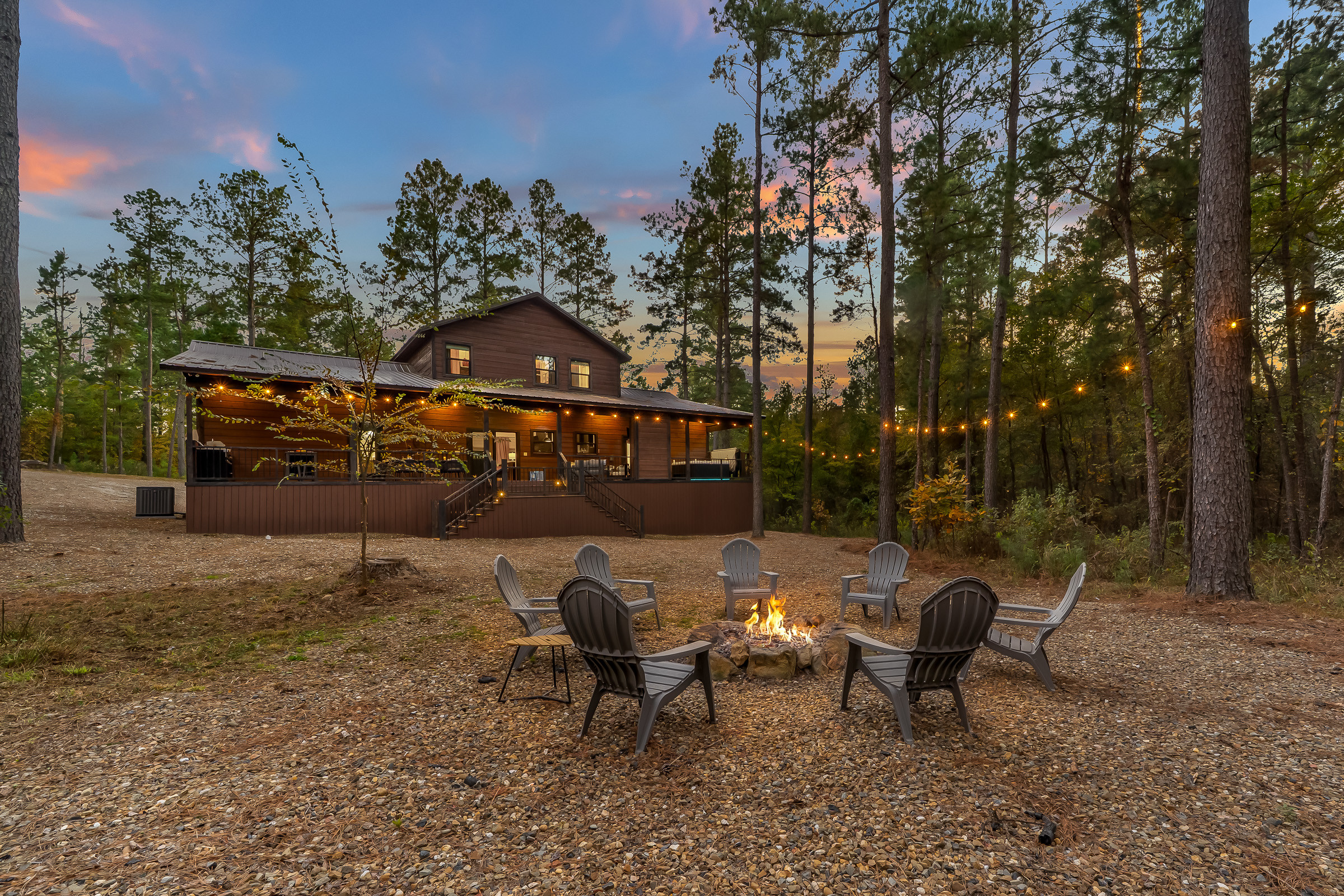 Your own campfire haven under string lights. Perfect for sunsets, stargazing, and late night conversations.