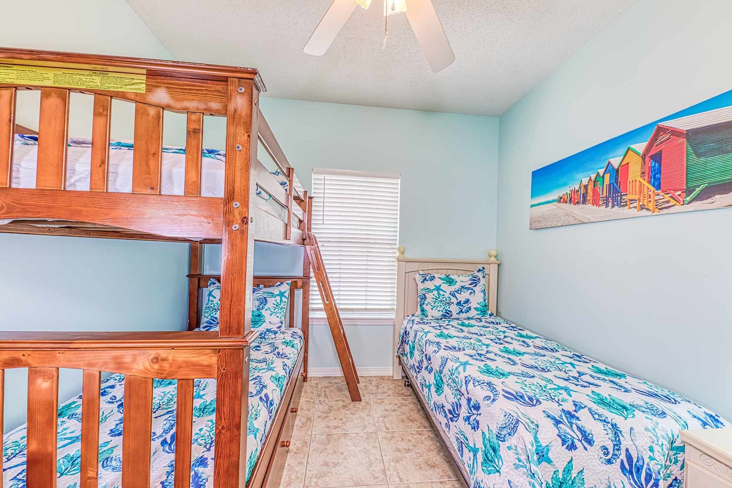Bunk Room: Fun-filled space with playful decor and colorful beach vibes perfect for kids!
