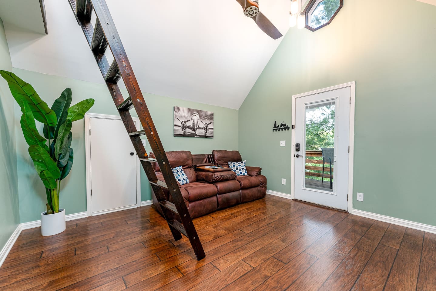 Library ladder folds out for access to loft.