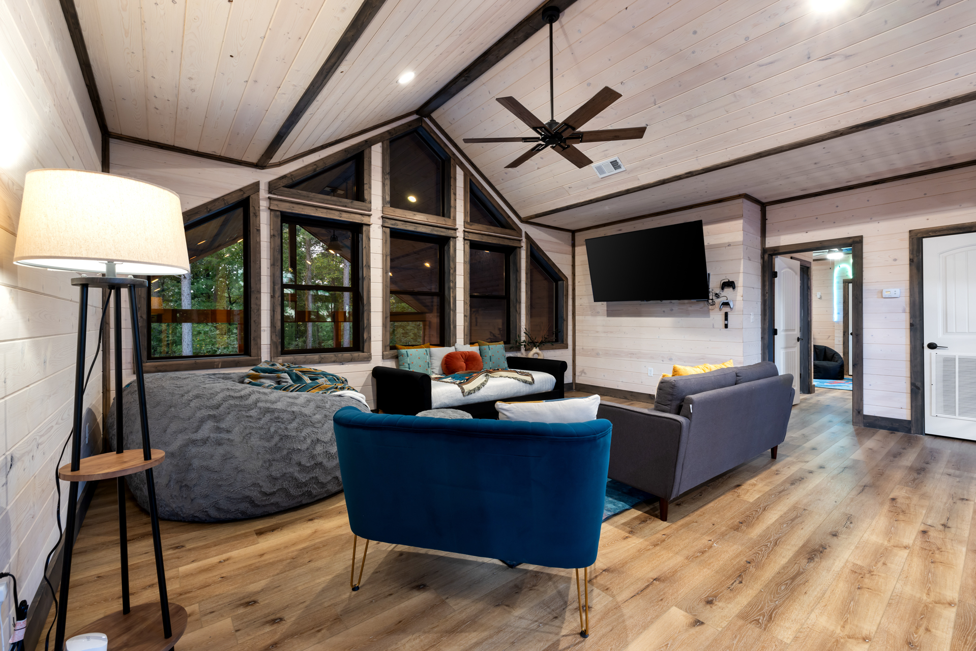 With soaring ceilings, oversized windows, comfy lounge seating, and plenty of space to gather, this bonus loft quickly becomes everyone’s favorite place to unwind after a full day outside.