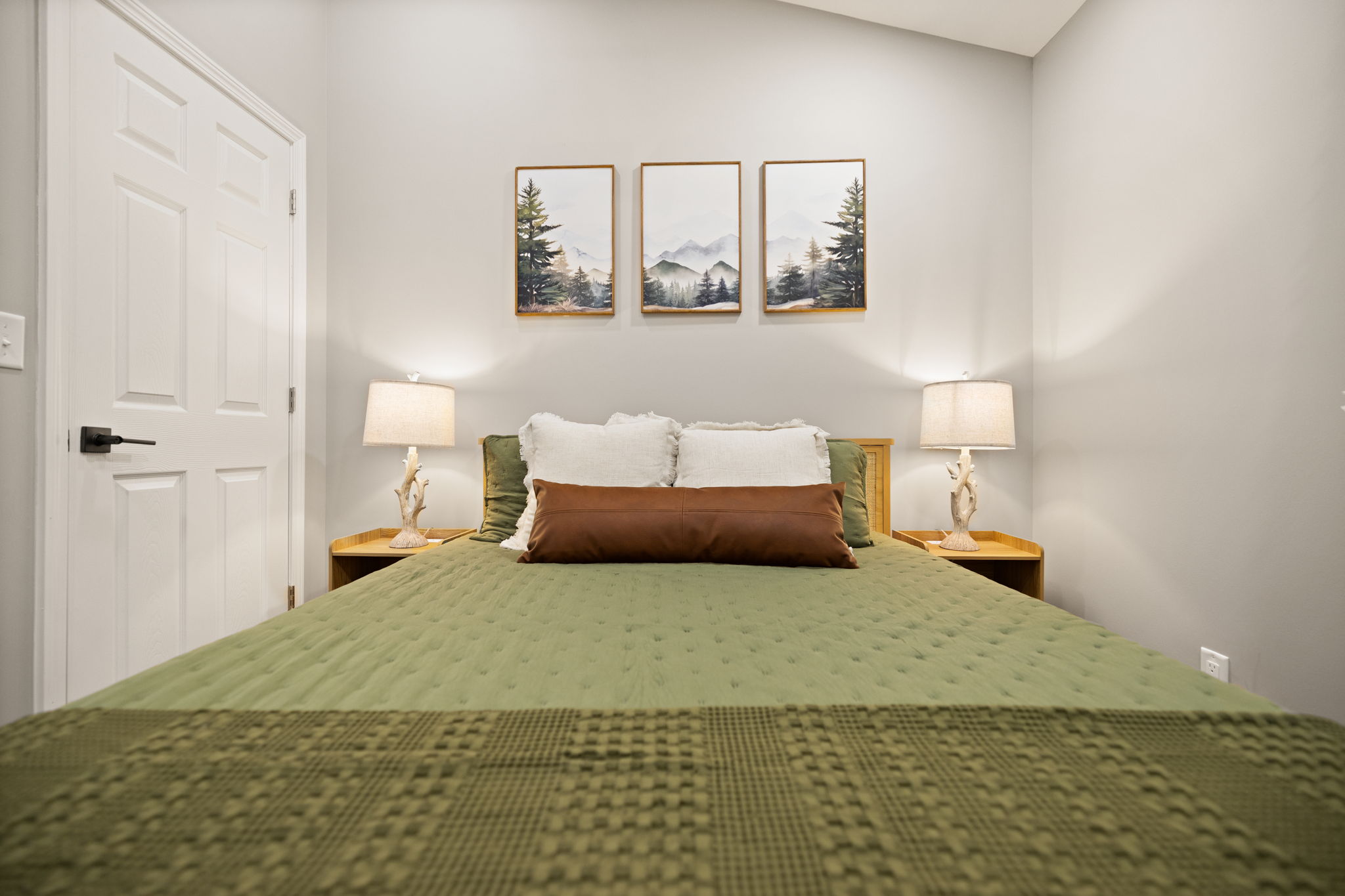 A restful night's sleep awaits in the main bedroom, featuring a plush queen mattress and room darkening shades.