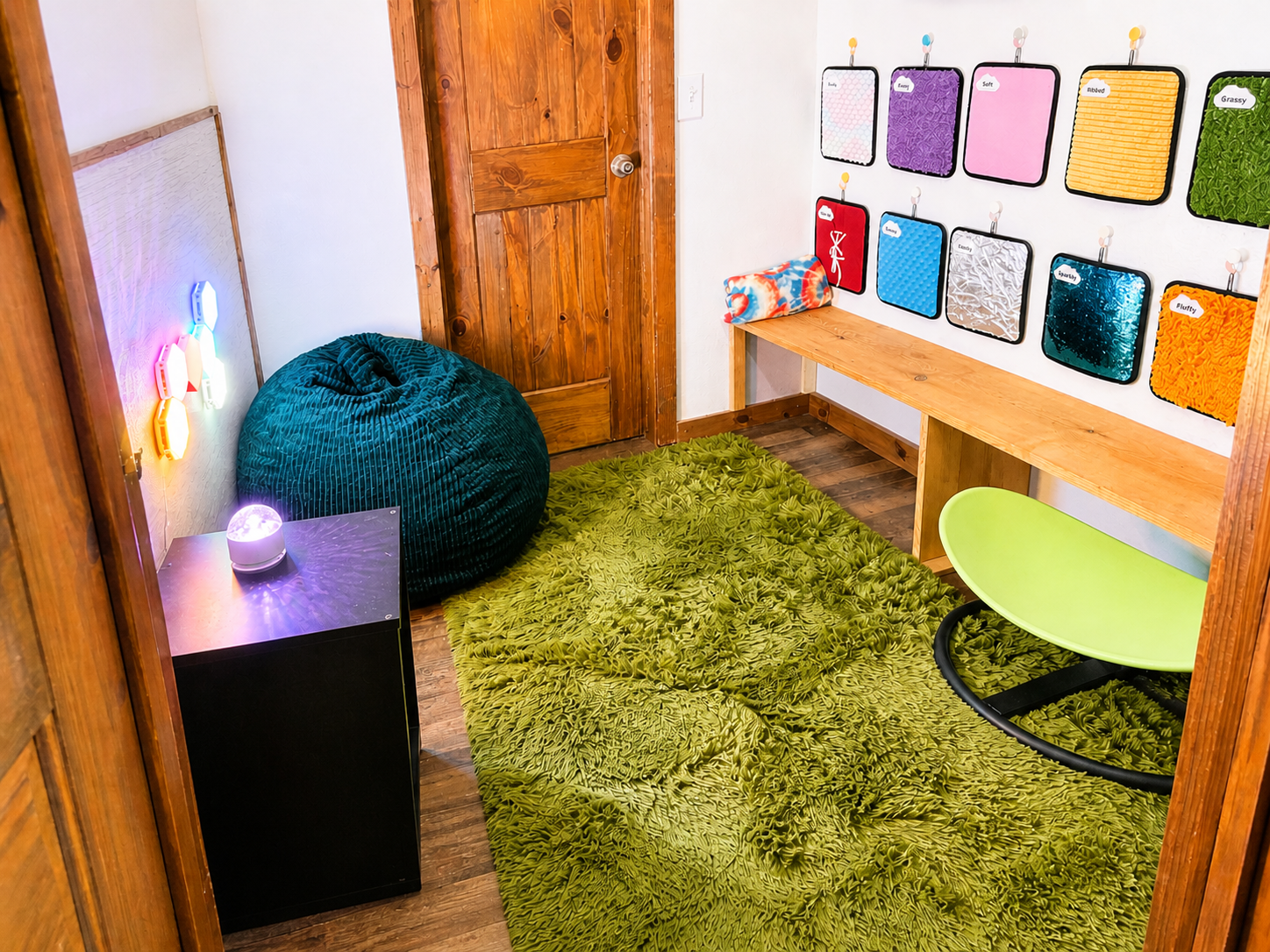 Sensory room with calming lights, textiles, and bean bag.