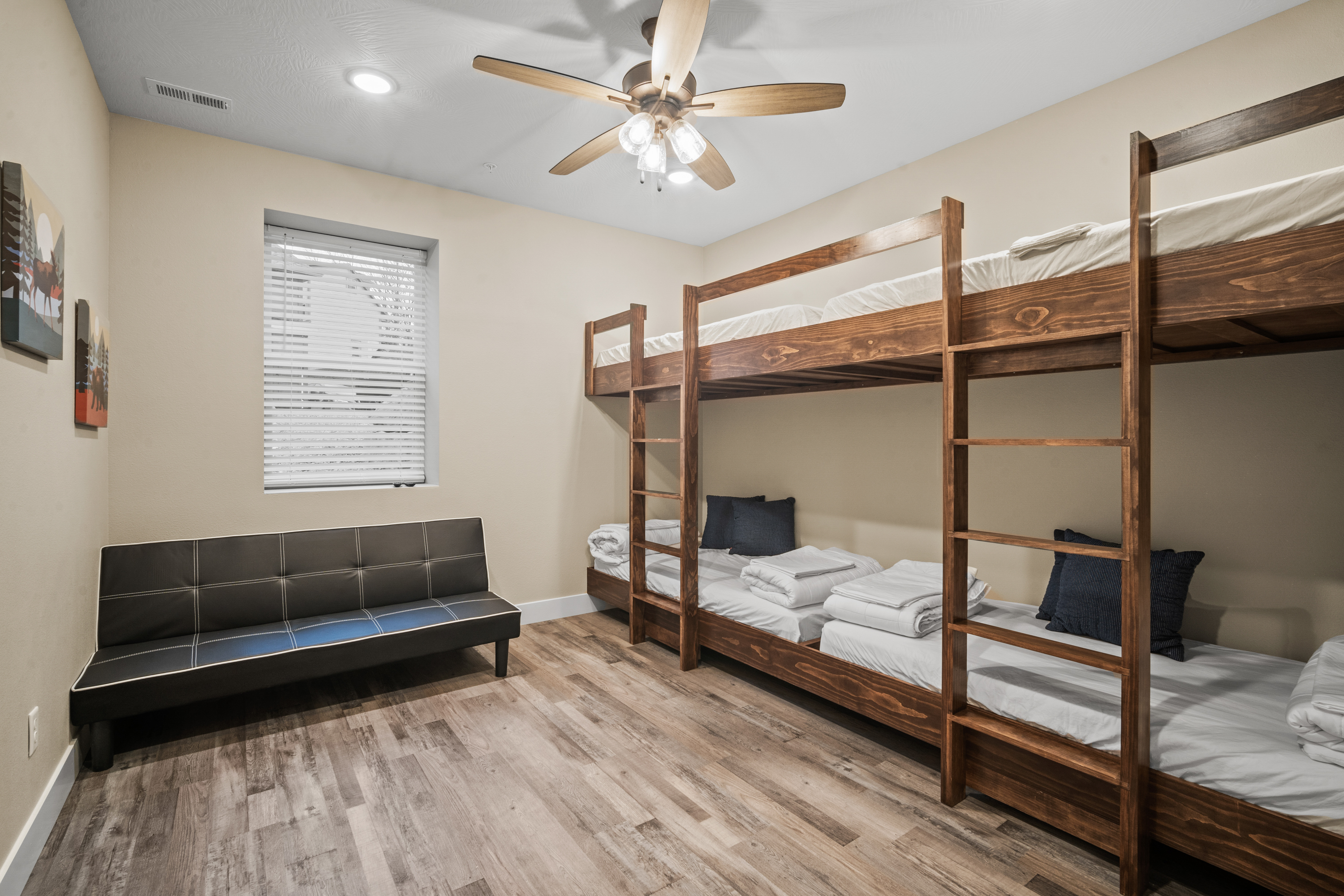 Bedroom #6 has four bunk beds, a click clack sofa that folds down to a bed, TV and closet. Sleeps 5.